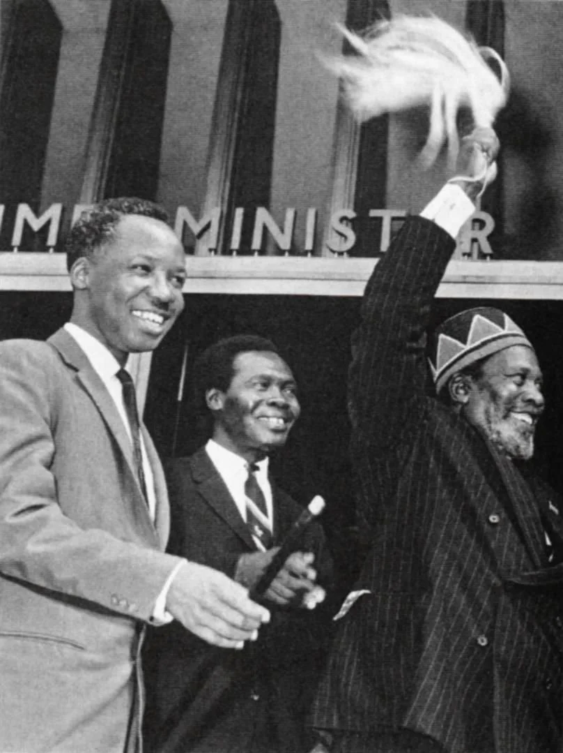 two men in suits and.png