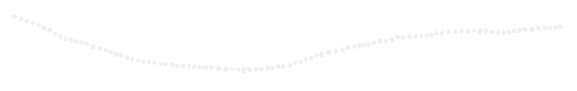 A string of white dots forming a curved and wavy line.