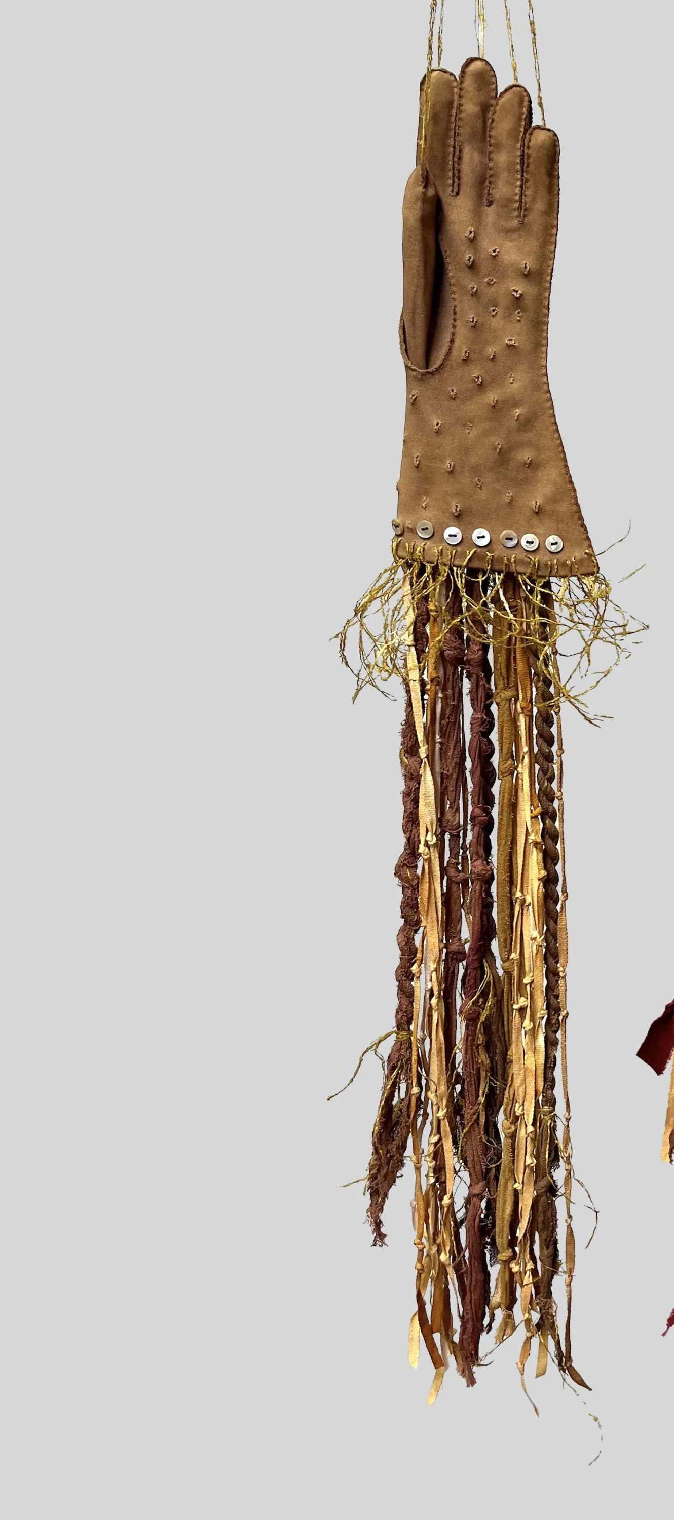 Rose Glove 1,  2025  3’ x 6”, Vintage glove, cheesecloth; silk, shell buttons  Dyes: Redwood cones, iron,  $200.