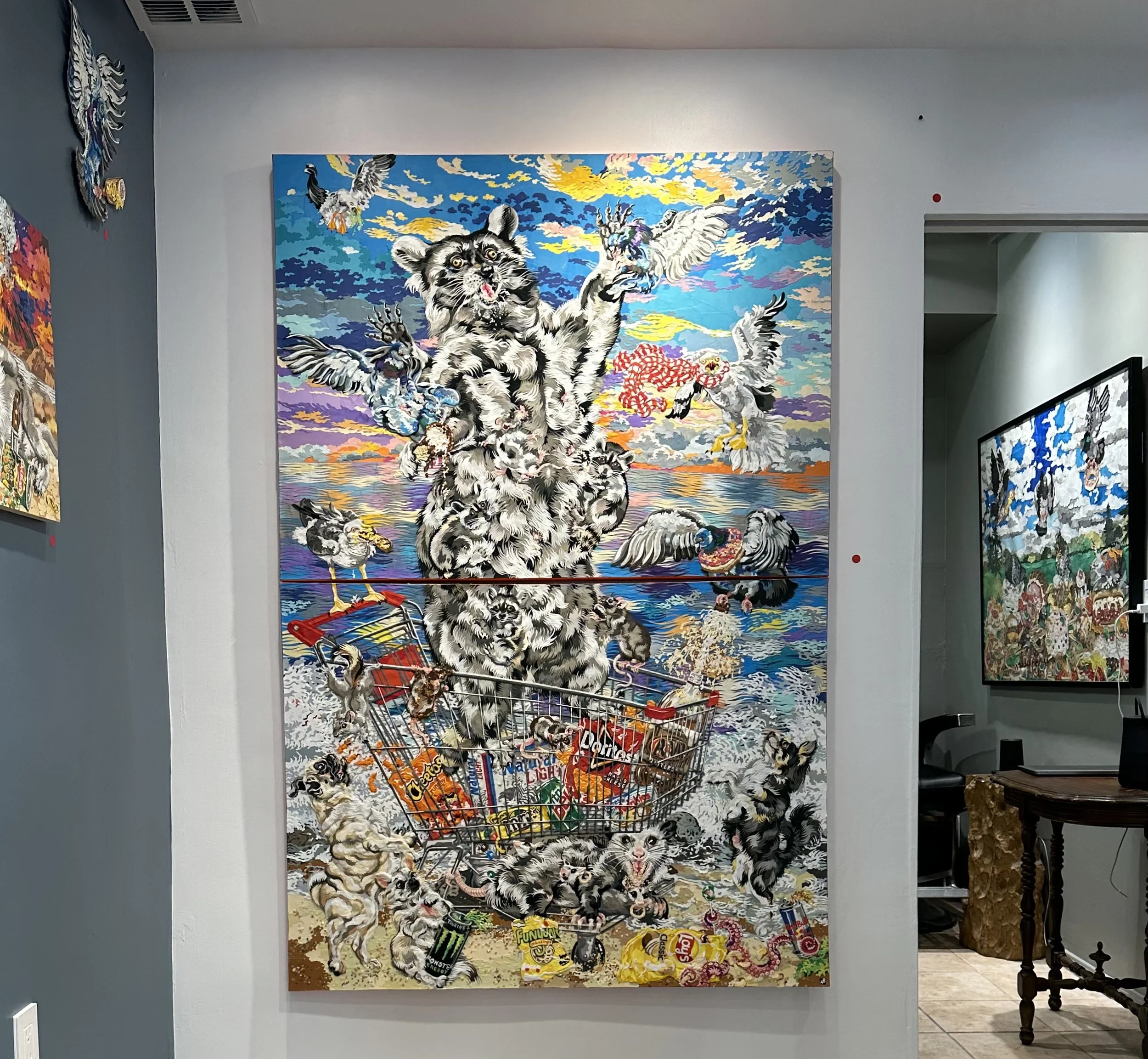 "Birth of Raccoon,' 72X48in, handout paper and gel medium on canvas, 2022, $9,998.