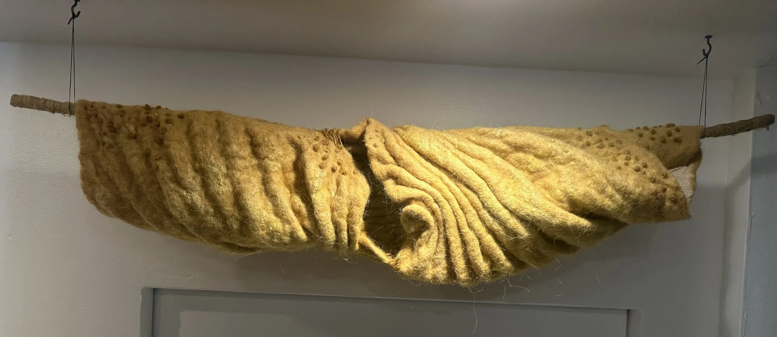 Golden Cradle, 2023  3’w x 1’h  Wool, silk; Marigold dye  $800.