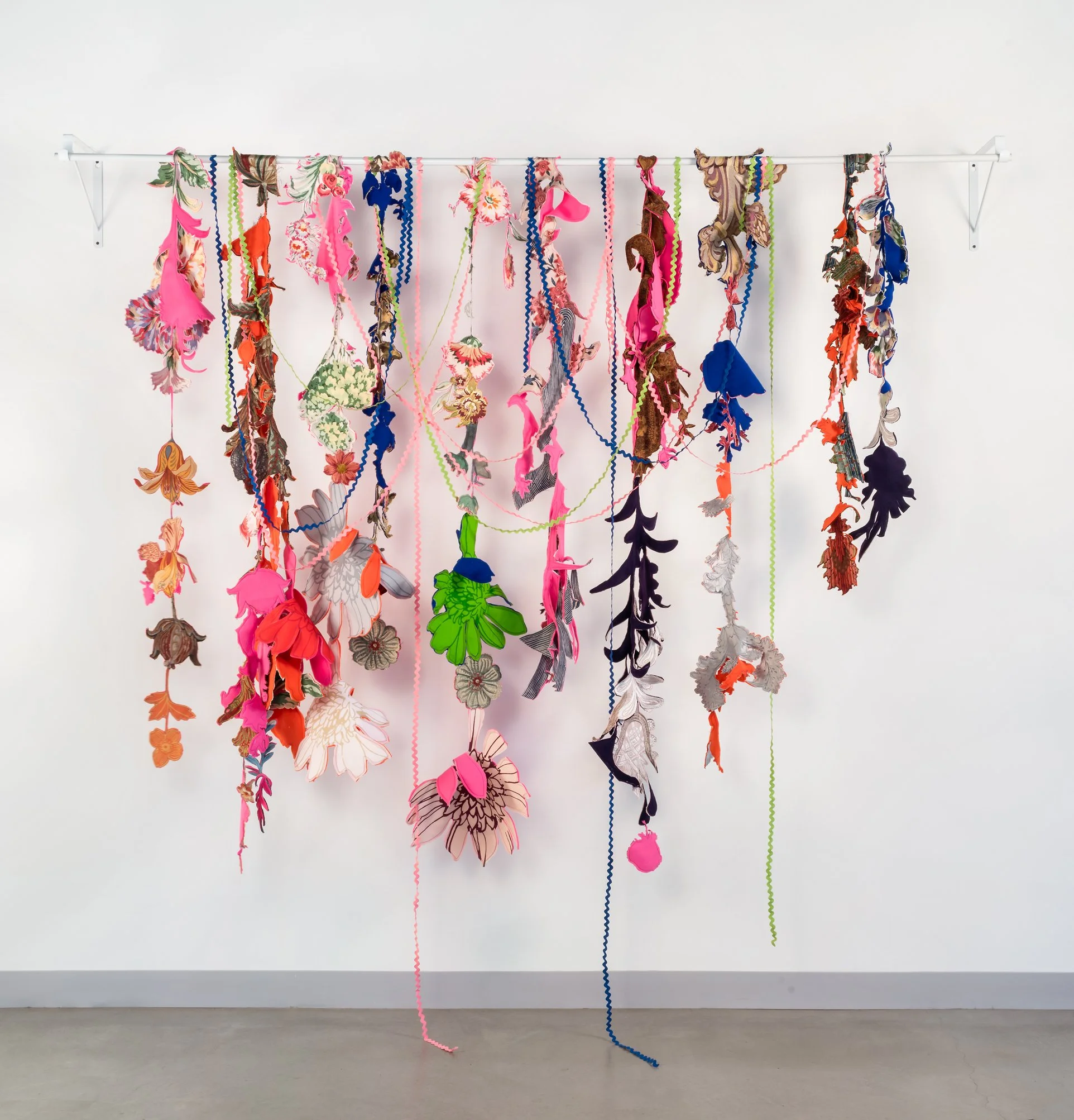 Knee Deep in Your Dreams, 2025, Repurposed fabric fragments, thread, bracket, notions, 91 x 90 x 16 in.