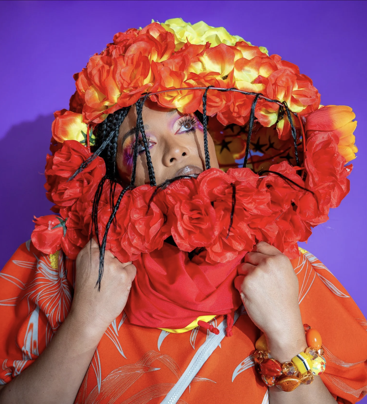 Afatasi the Artist in a tunic with floral space helmet 2024
