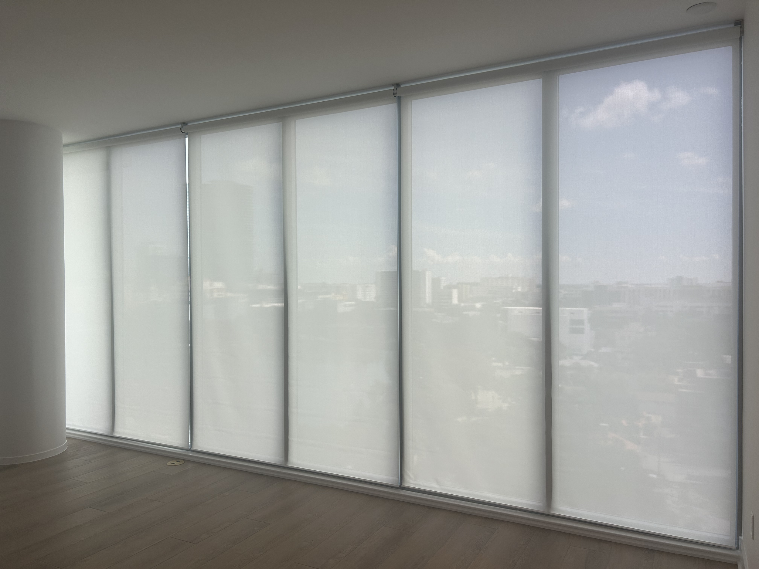 lutron-palladiom-shades-in-condo-highrise.png