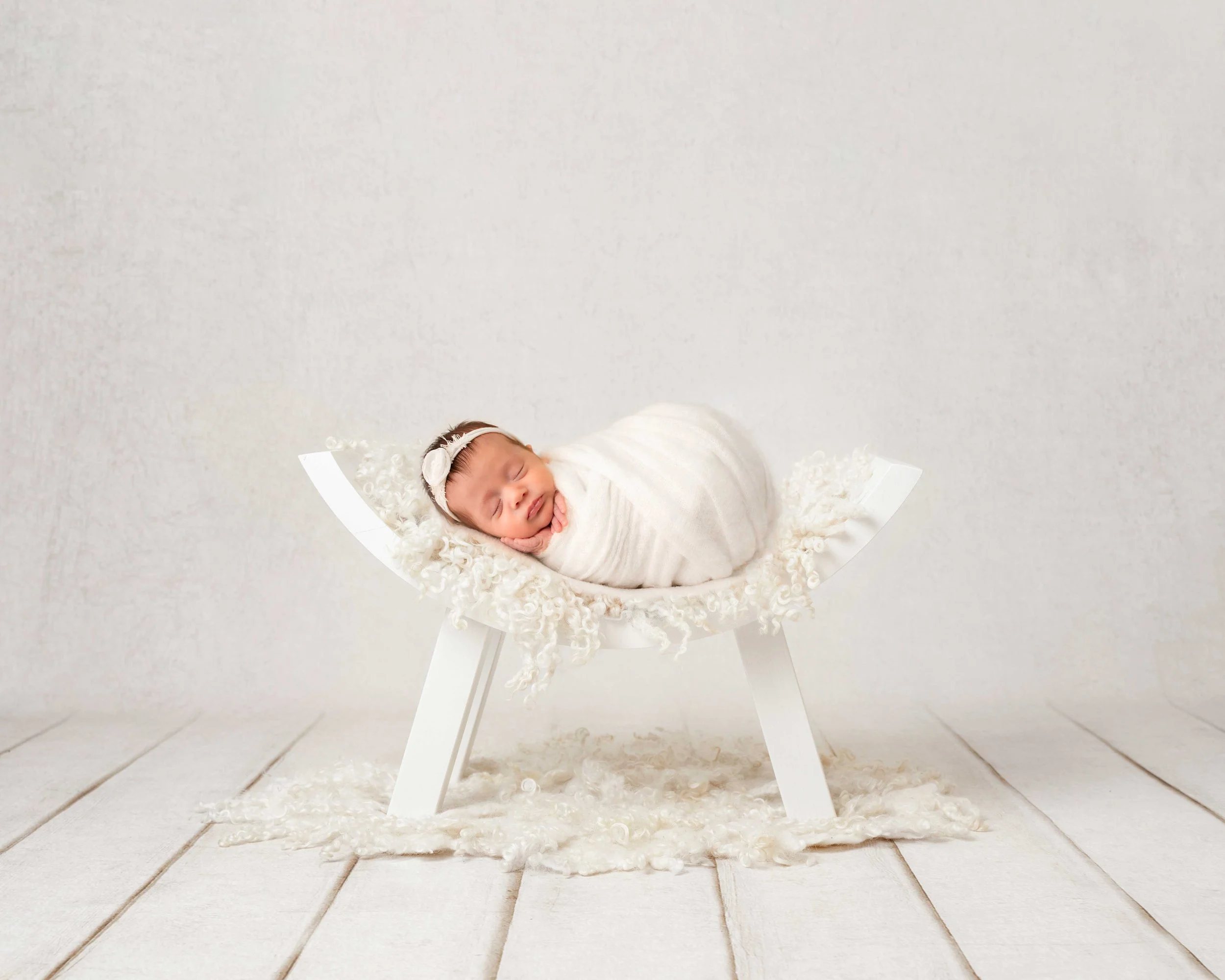 Swaddled newborn portrait captured during a newborn photo session