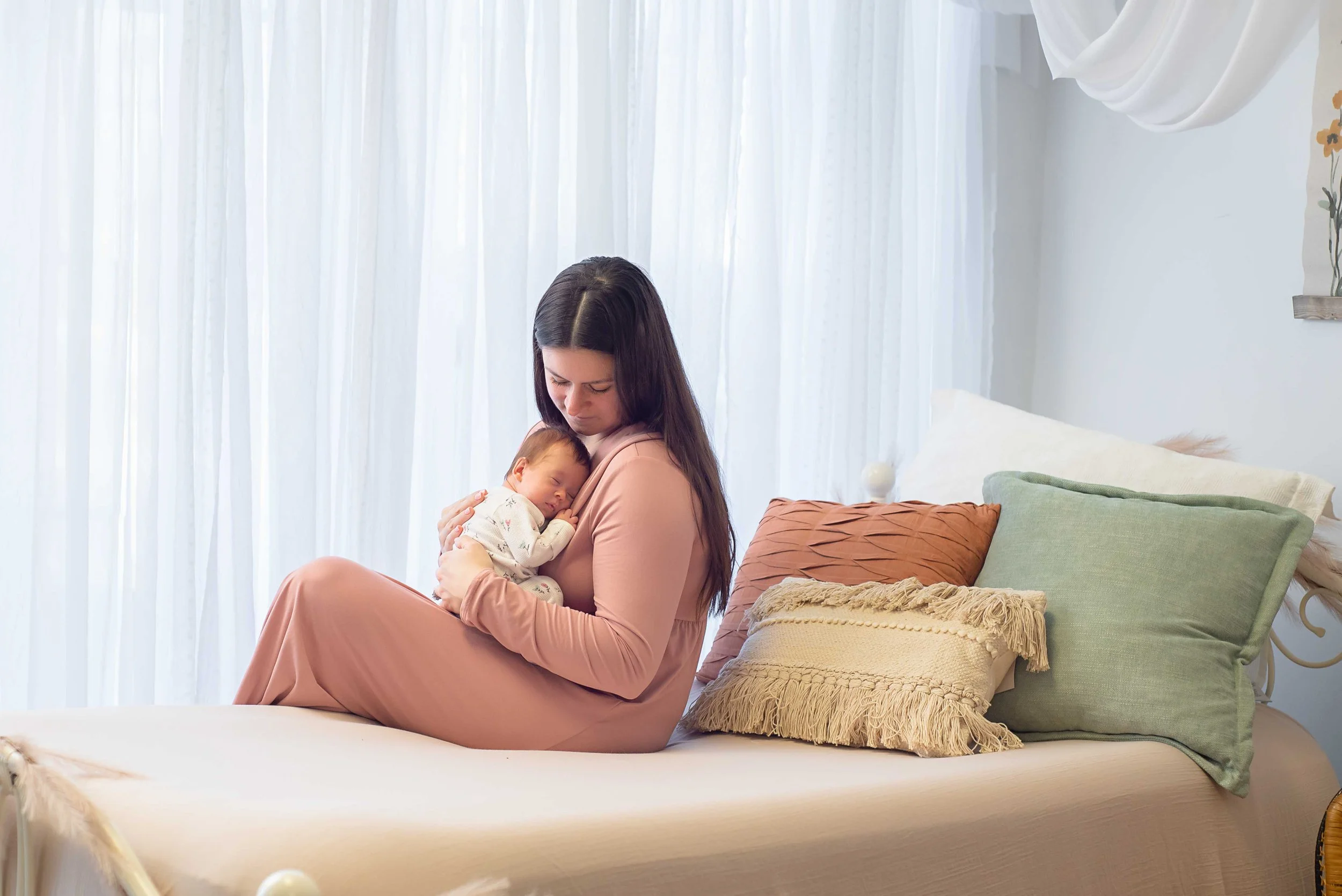 Newborn family photography moment with mother and baby
