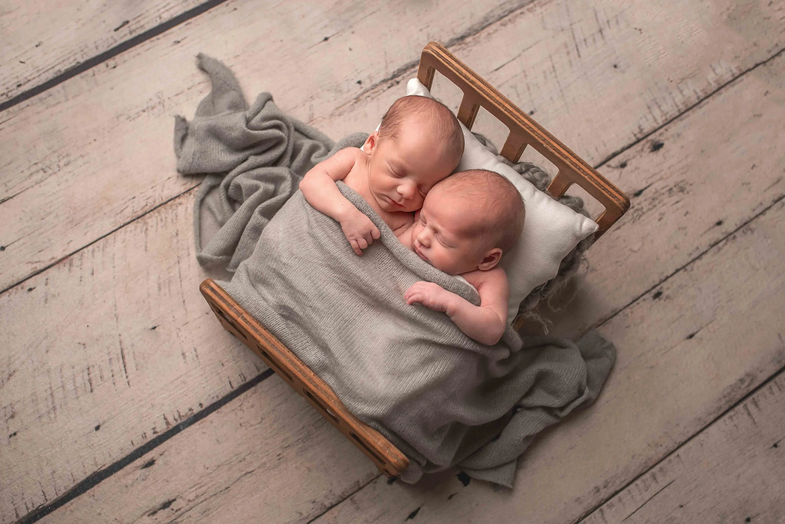 Rhode Island newborn photography twin baby boys sleeping in a prop bed by Anna Kay Photography
