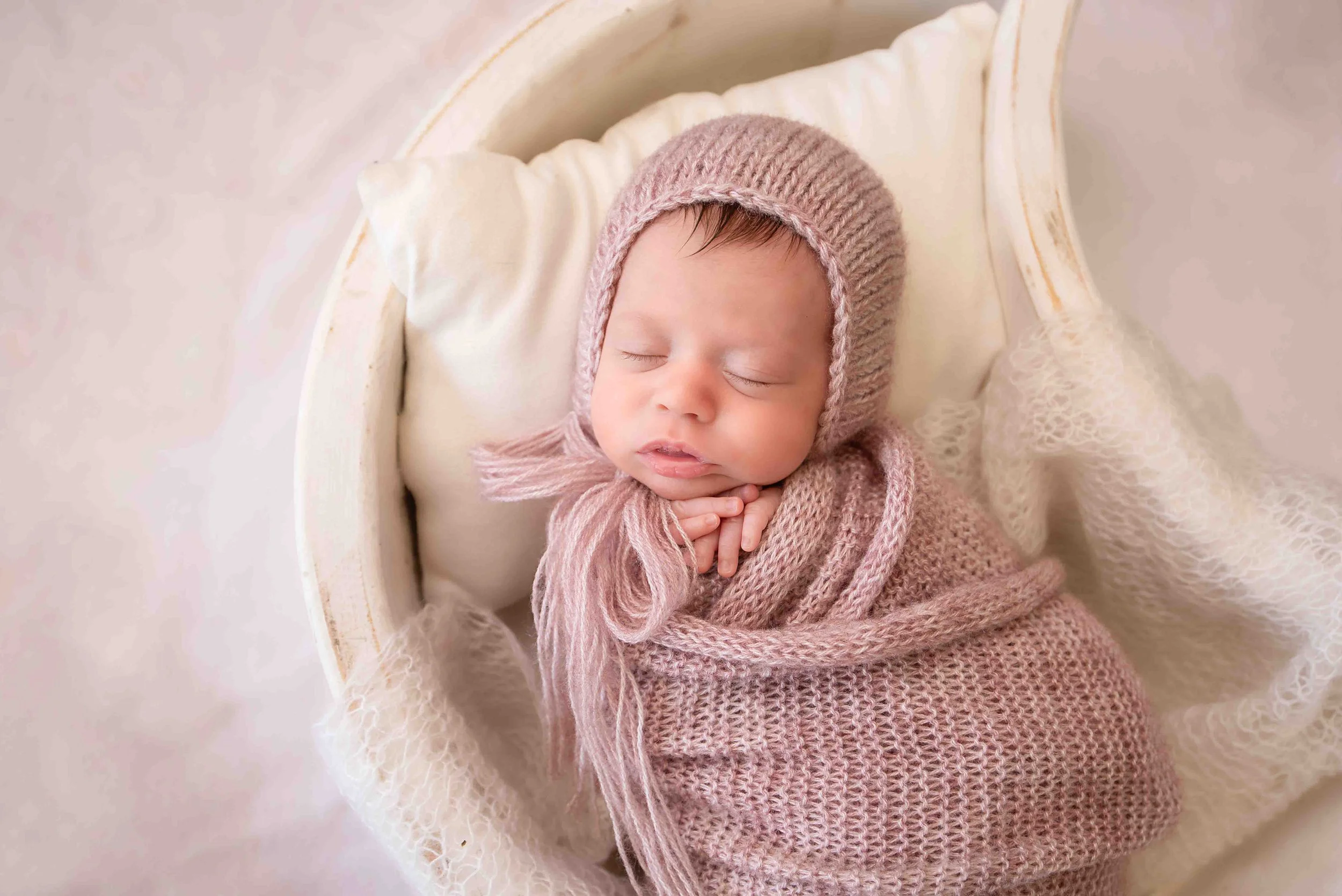 Swaddled newborn portrait captured during a newborn photo session