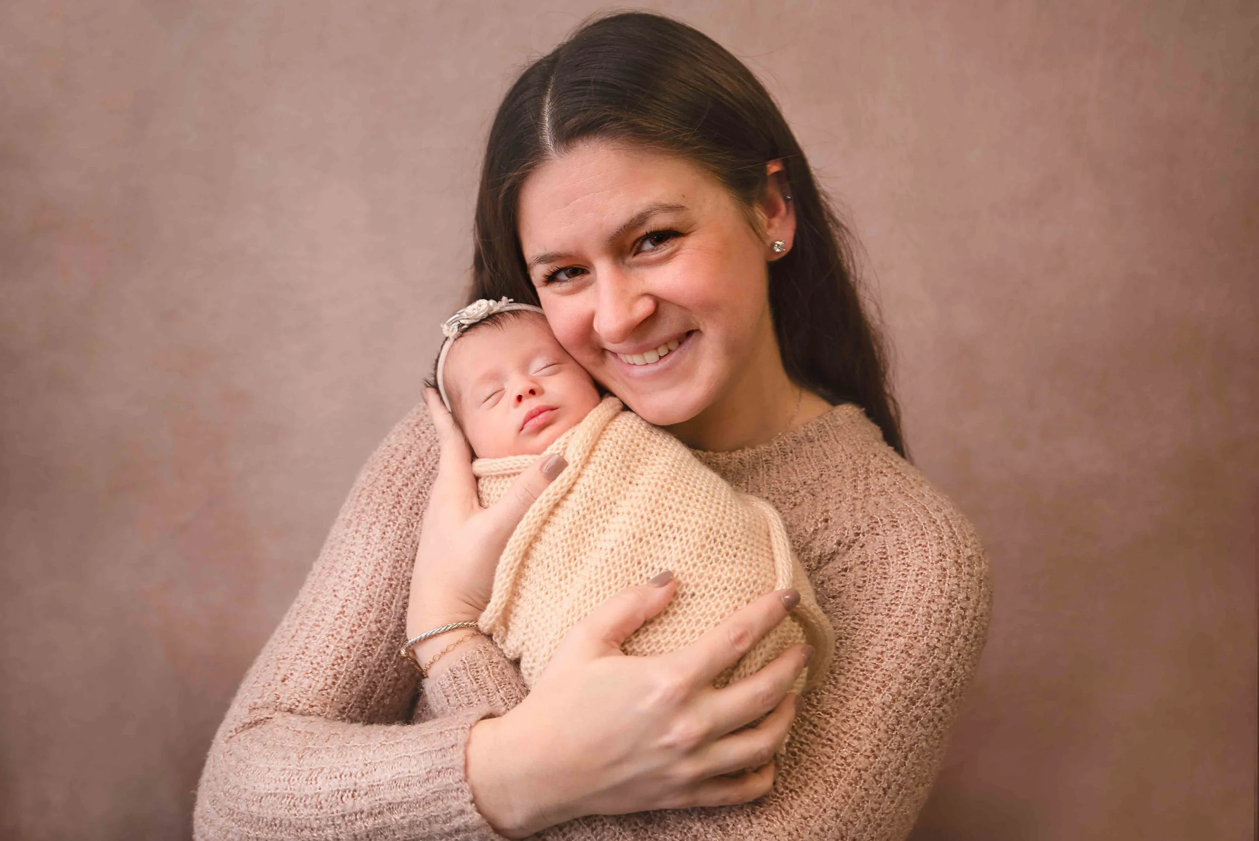 Newborn family photography moment with mother and baby
