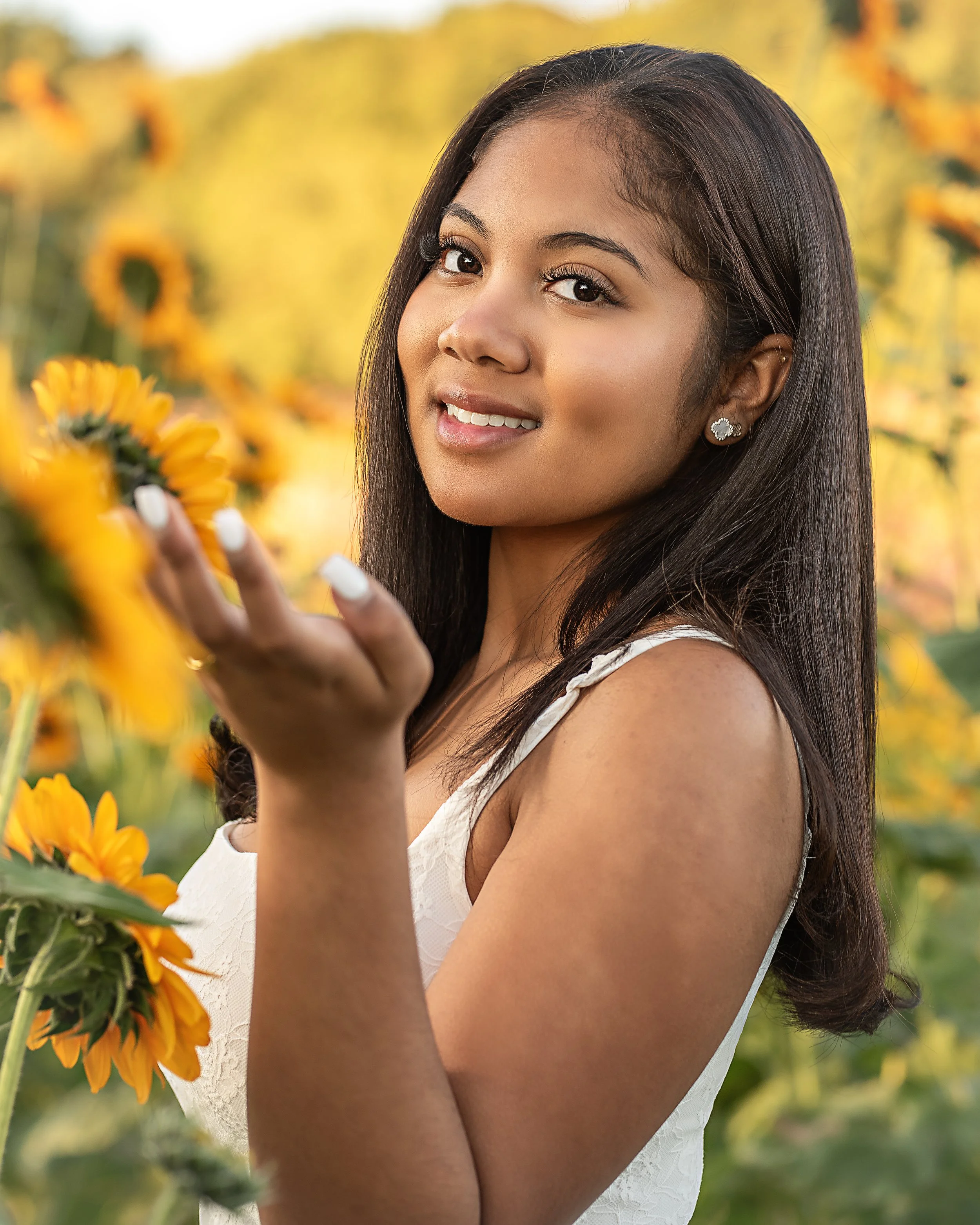 Senior portrait in sunflower field