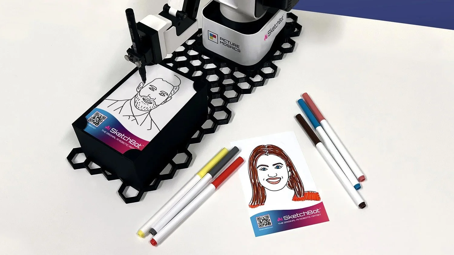 Portrait sketches drawn by SketchBot and hand-colored by guests