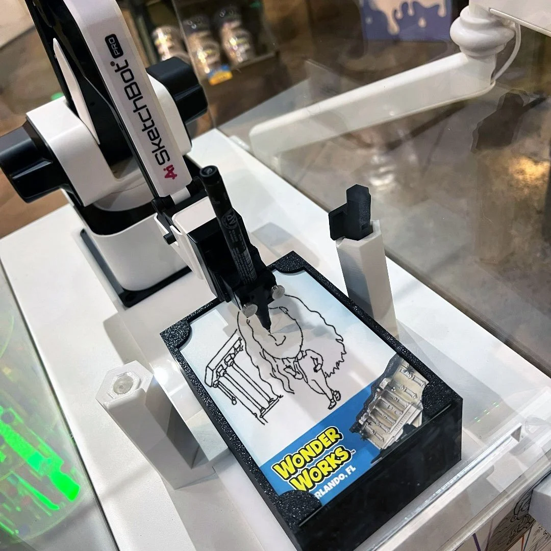 SketchBot drawing a caricature at WonderWorks in Orlando, FL