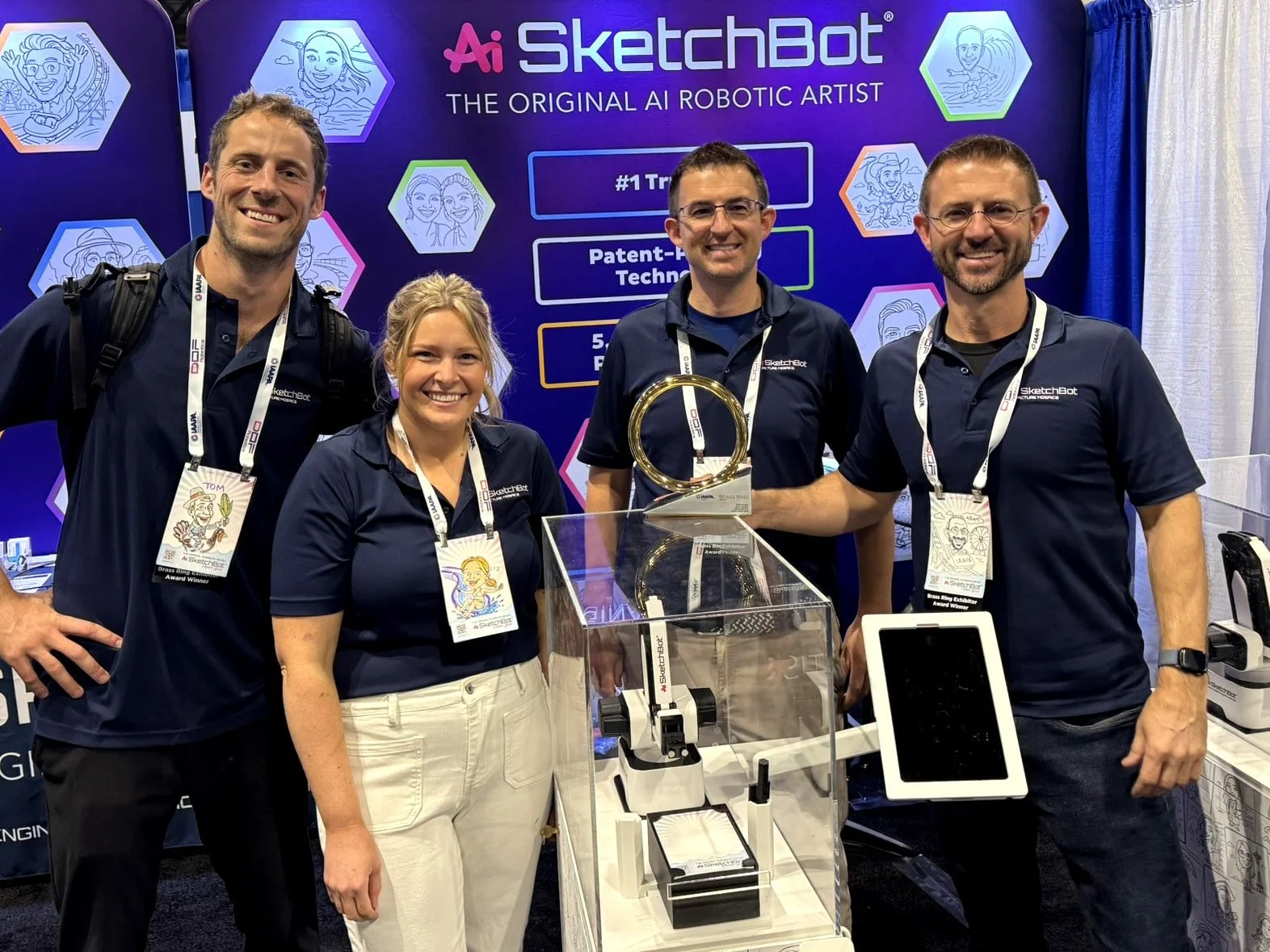 Ai SketchBot team posing for a photo with the IAAPA Brass Ring Award