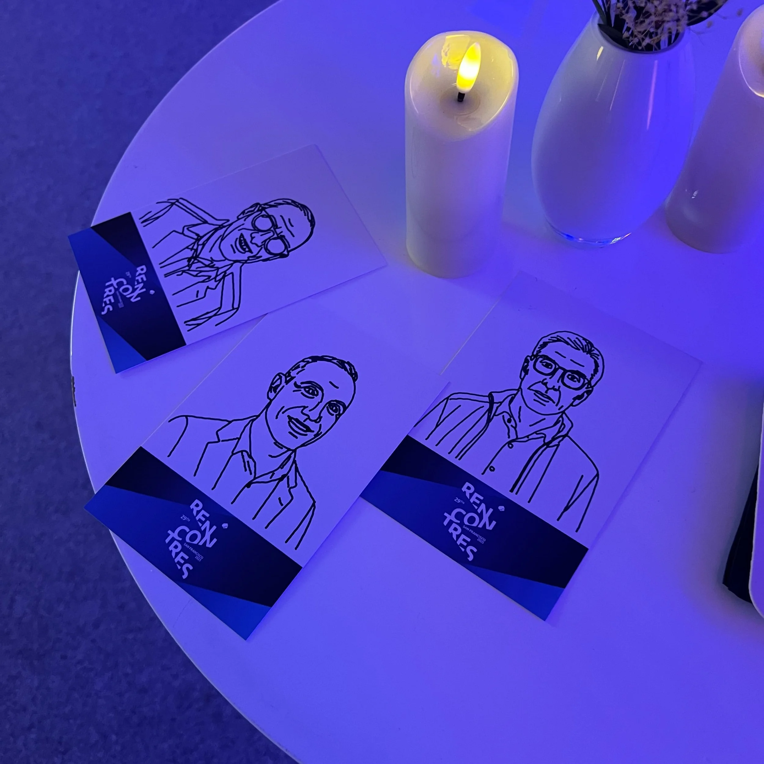 Sketches laid out on a table at an event