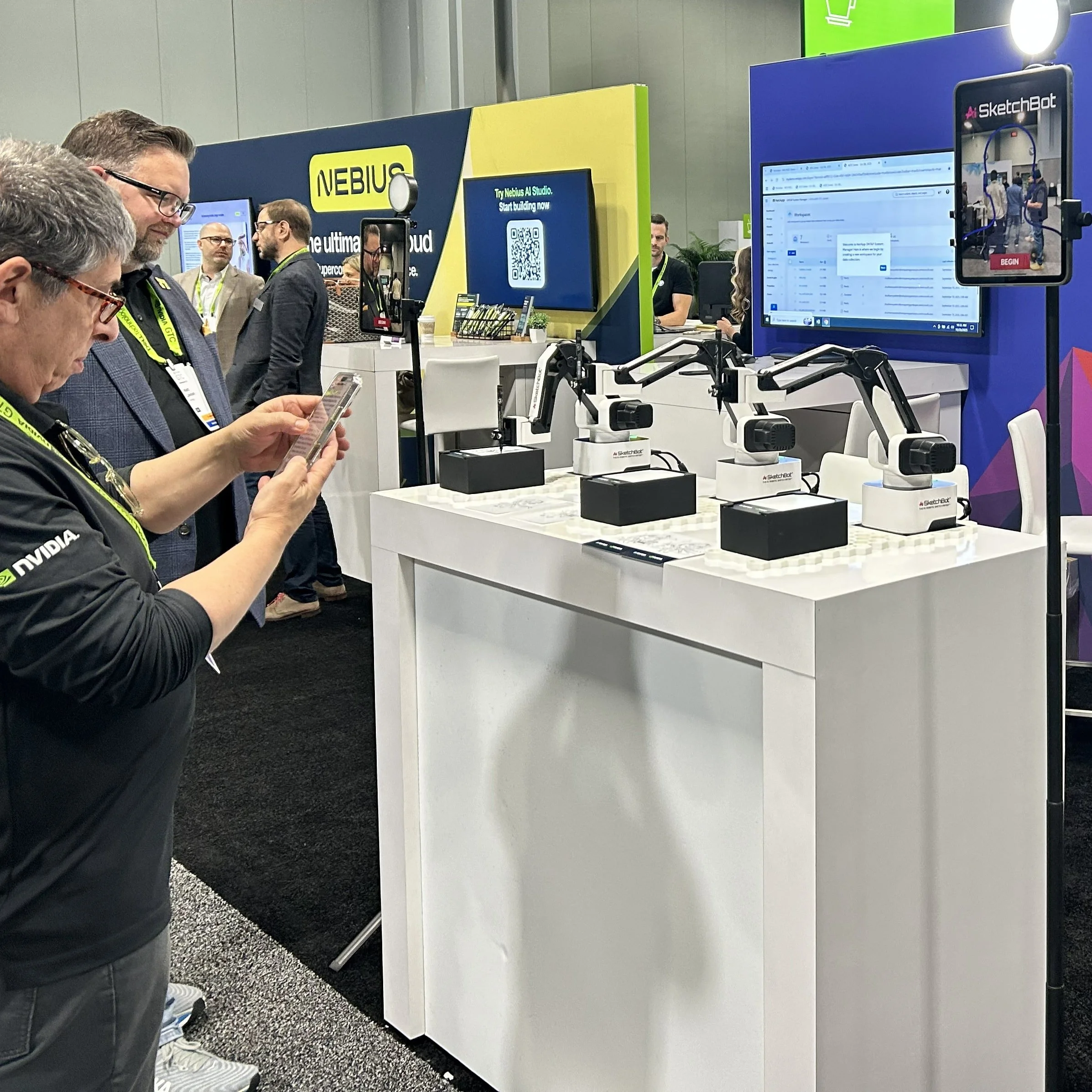 A fleet of SketchBots on a table, ready to draw