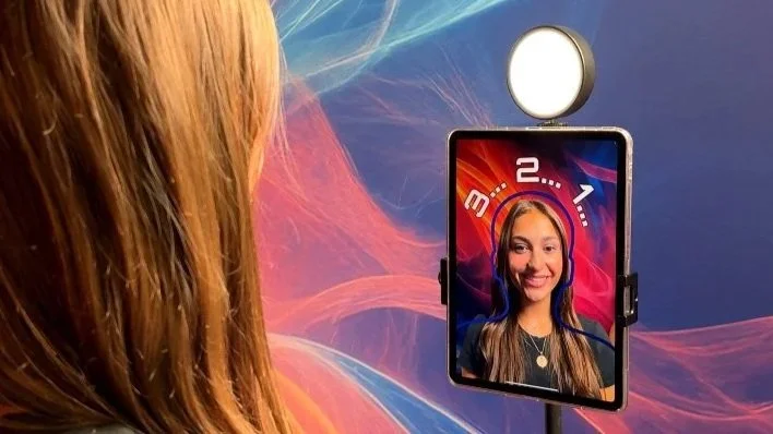 Guest taking a selfie for SketchBot to draw