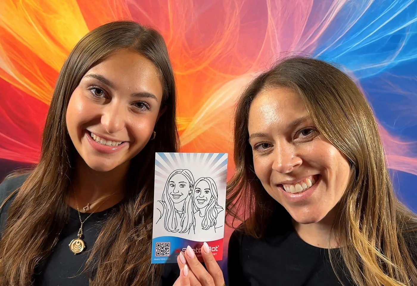 Two friends with their SketchBot-drawn portrait