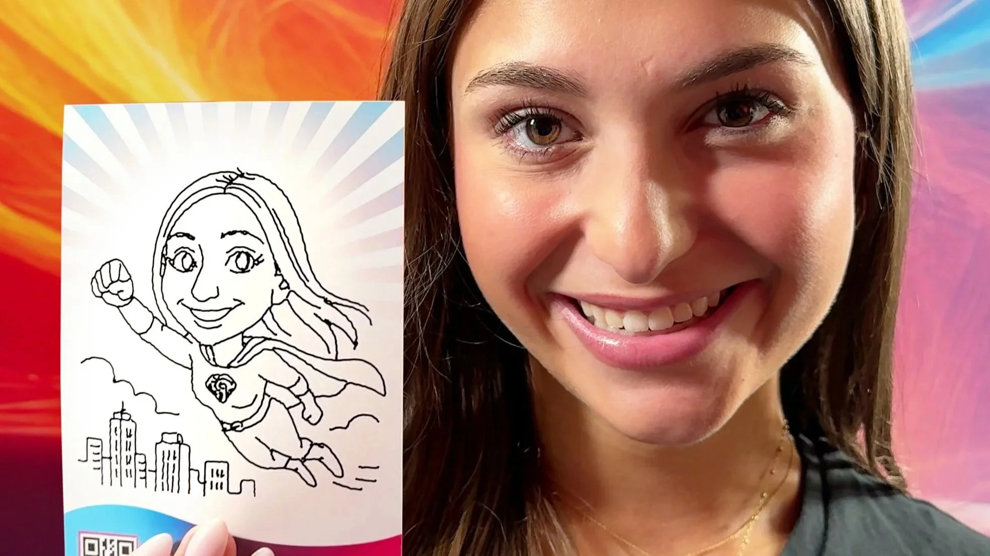 Guest holding up their fun superhero drawing made by SketchBot