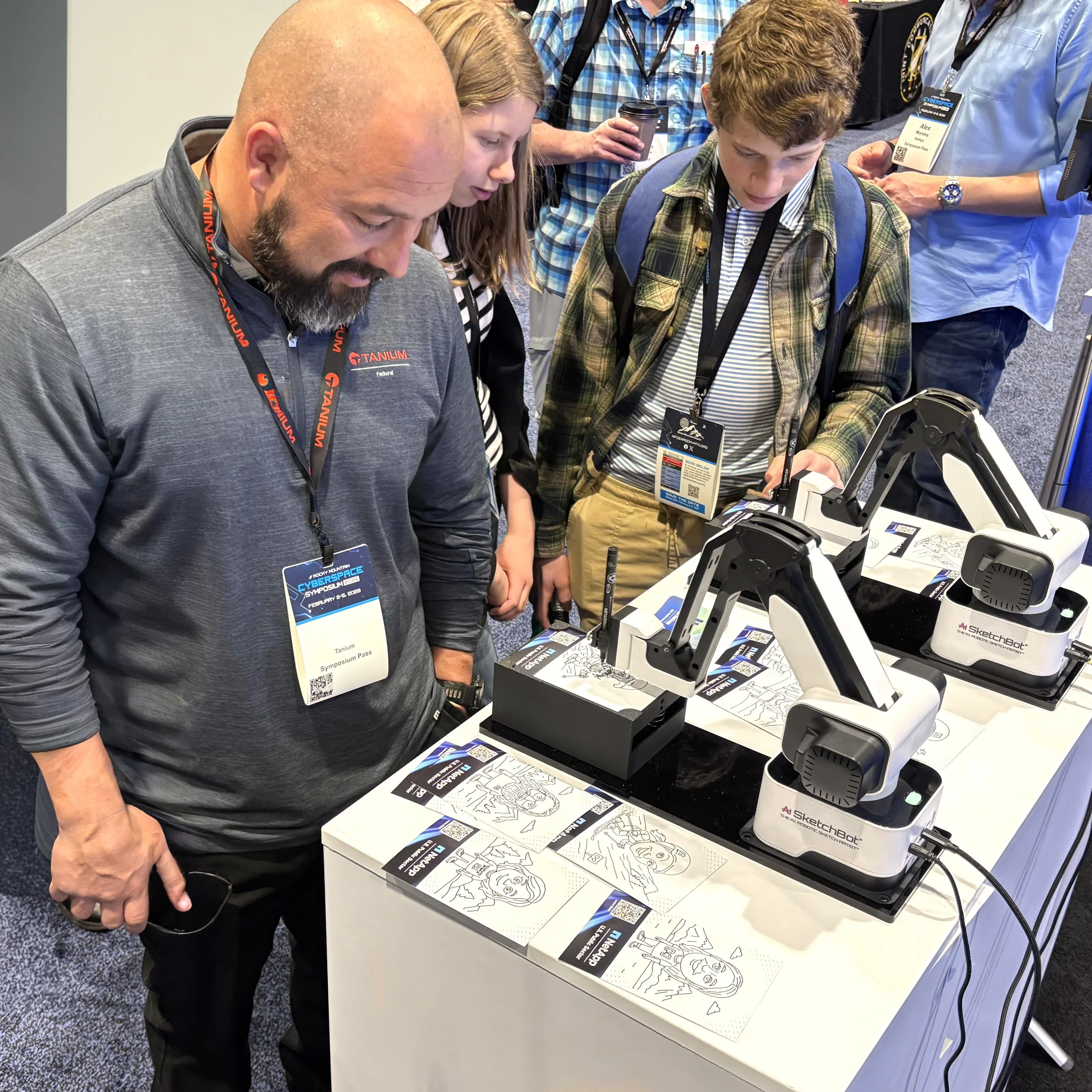 Participants interacting with the SketchBot