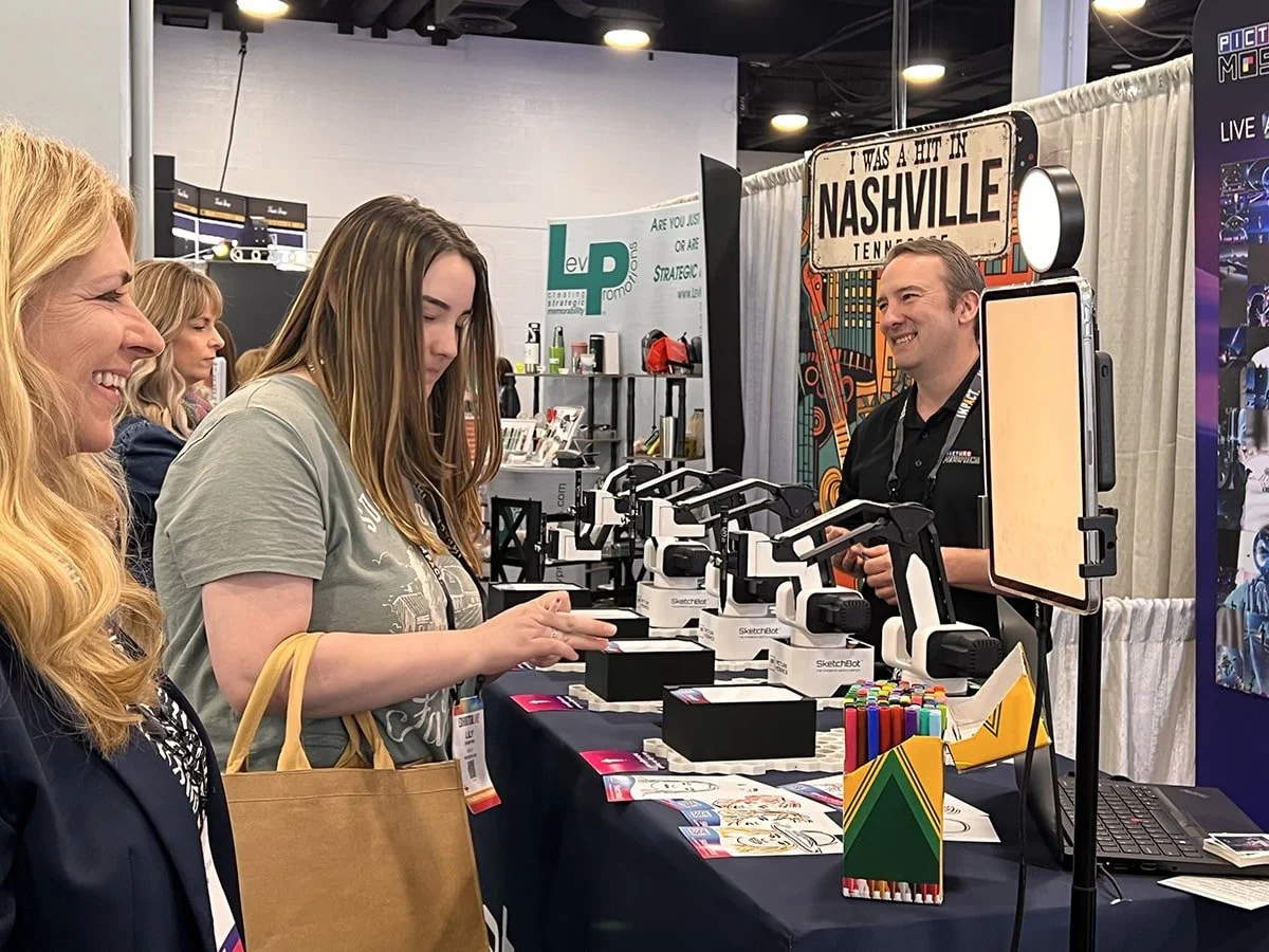 Guests having fun with SketchBots at Exhibitor Live
