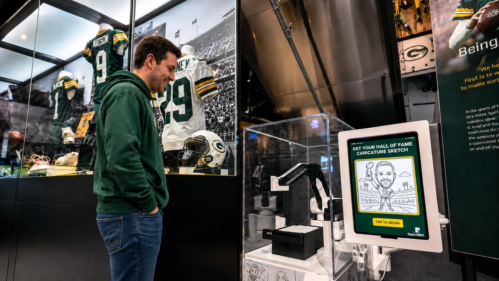 A man interacting with the SketchBot Kiosk at Lambeau Museum