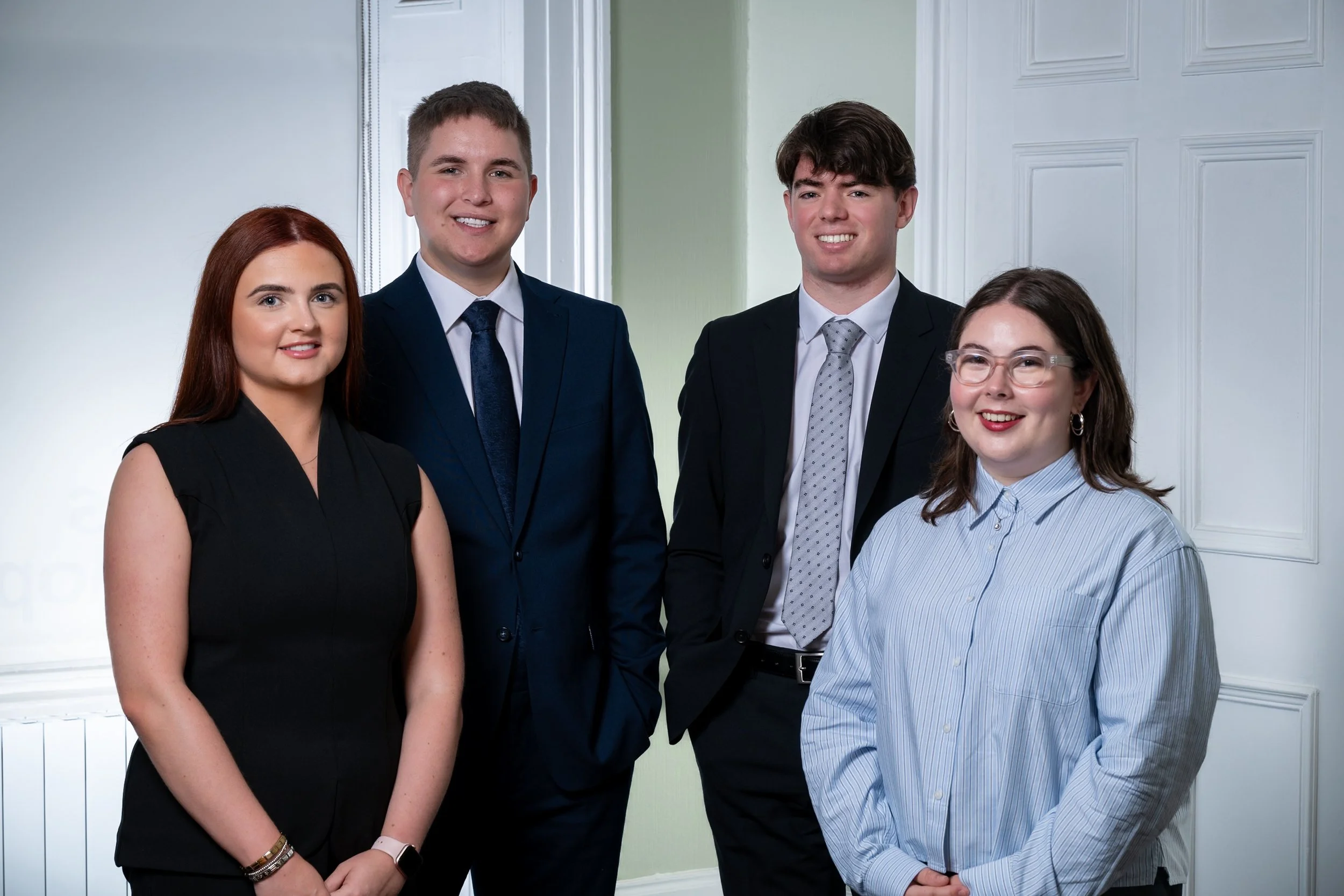 Holmes Mackillop appoints four trainee solicitors