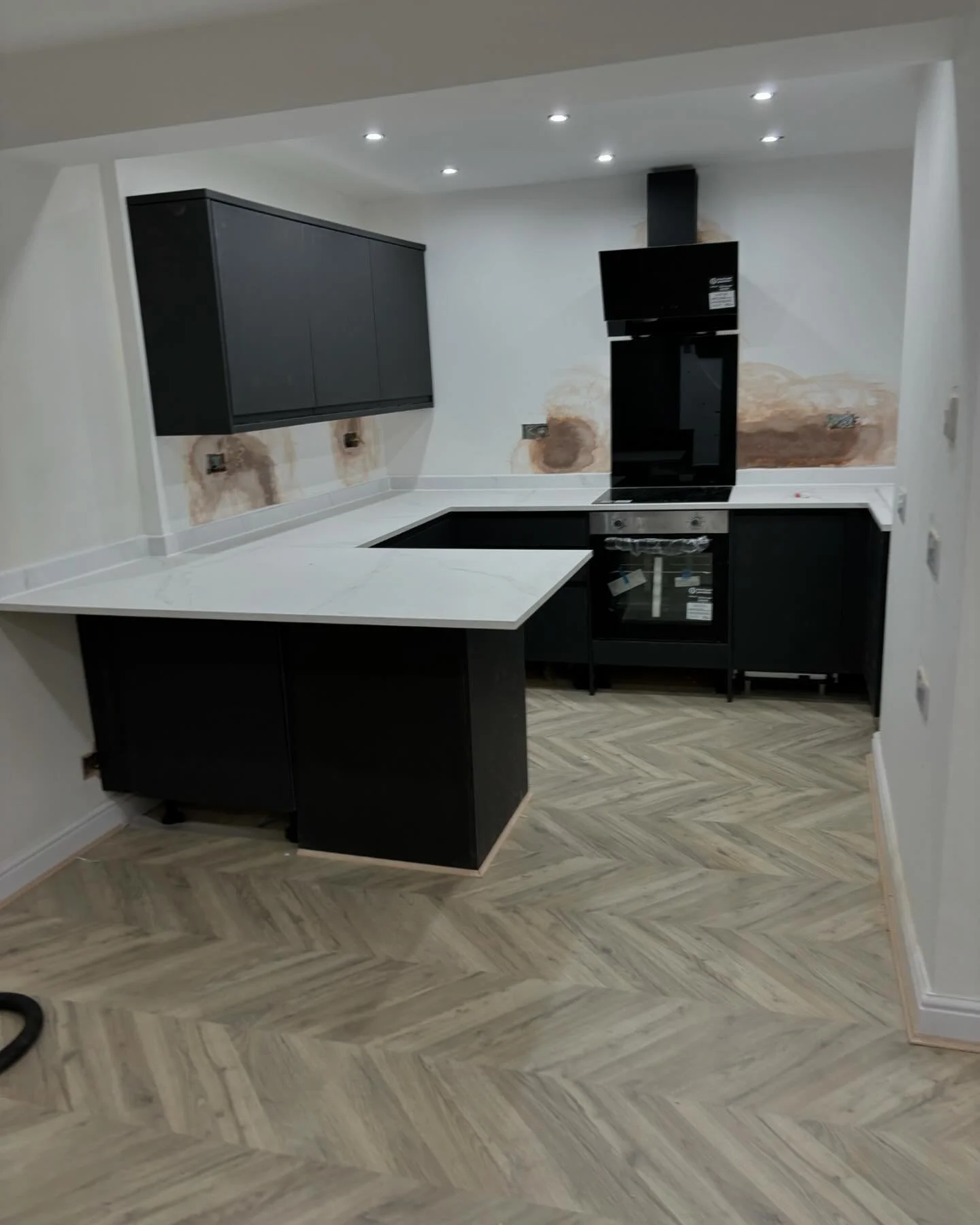 New kitchen, new flooring throughout the ground floor and under the stairs cupboard made in this converted coach house this week ready for painting and plinths to go on after electrics all finished