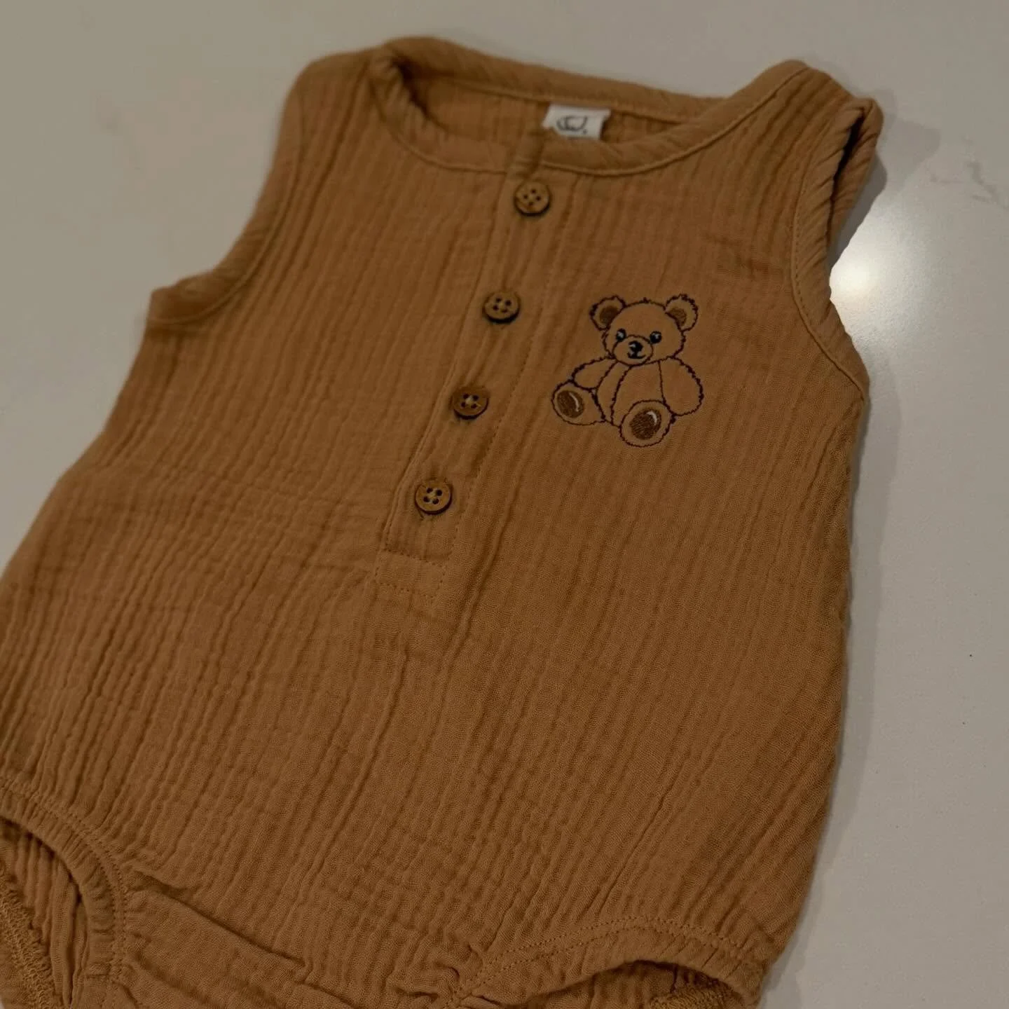 The cutest teddy bear embroidered onesie for when the weather starts to warm up! 🧸