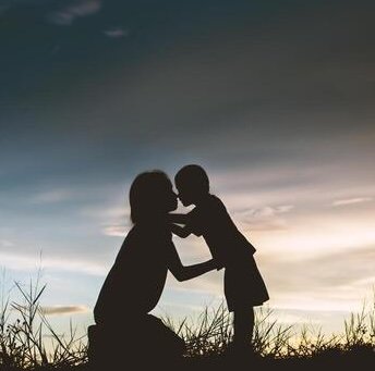 mother-encouraged-her-son-outdoors-at-sunset-silhouette-concept-free-photo.jpg