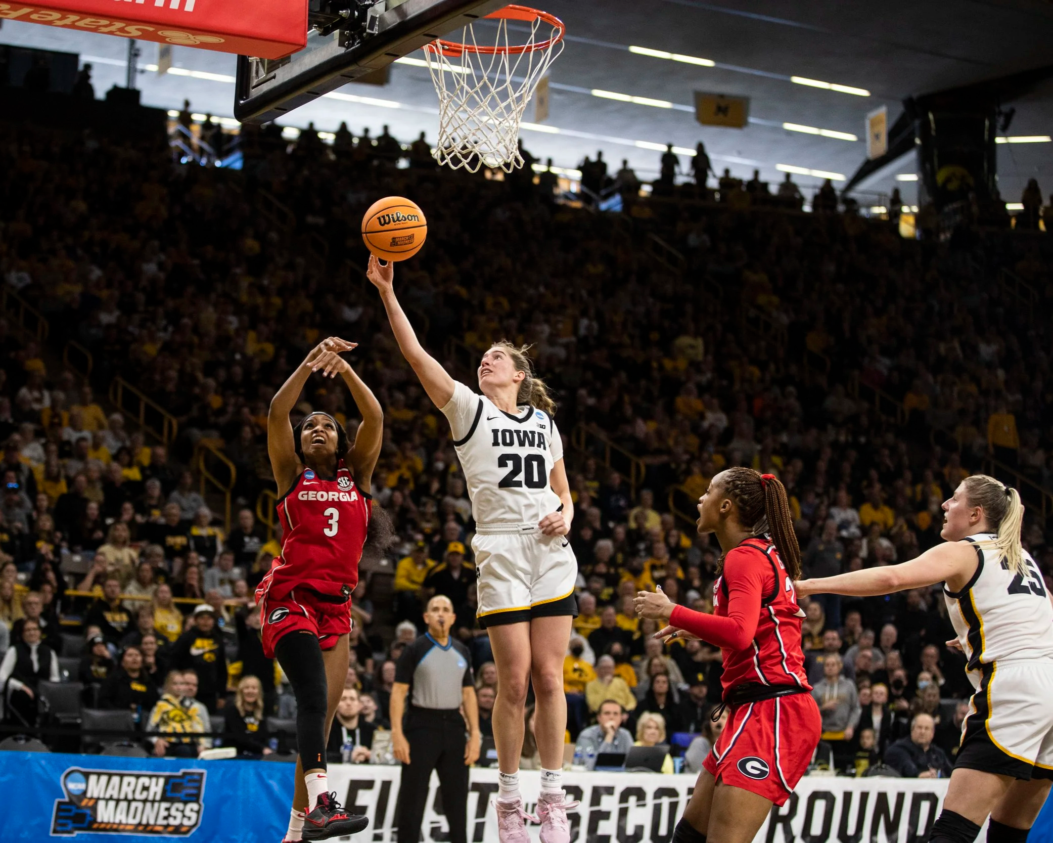 Iowa forward Kate Martin (20) tips the ball during the NCAA Women's Basketball Tournament round two game between Iowa and Georgia at Carver-Hawkeye Arena in Iowa City, Iowa on Sunday, March 19, 2023. (Daniel McGregor-Huyer/The Daily Iowan)