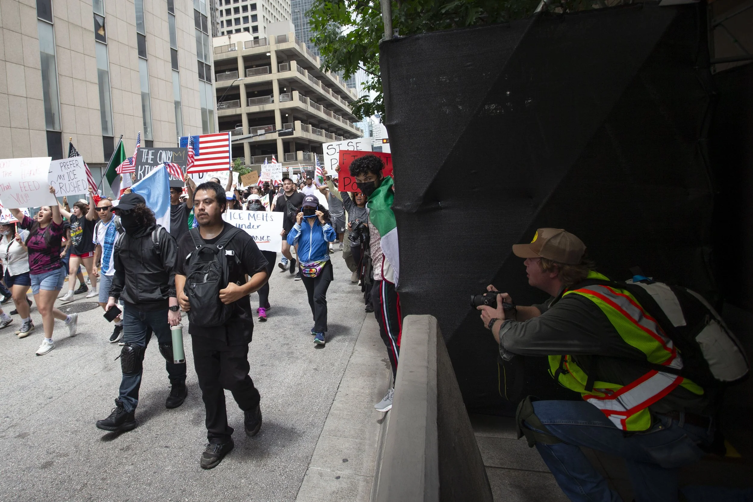 A photographer (far right) photographs the No Kings Protest in downtown Dallas on Saturday, June 14, 2025. (Daniel McGregor-Huyer)