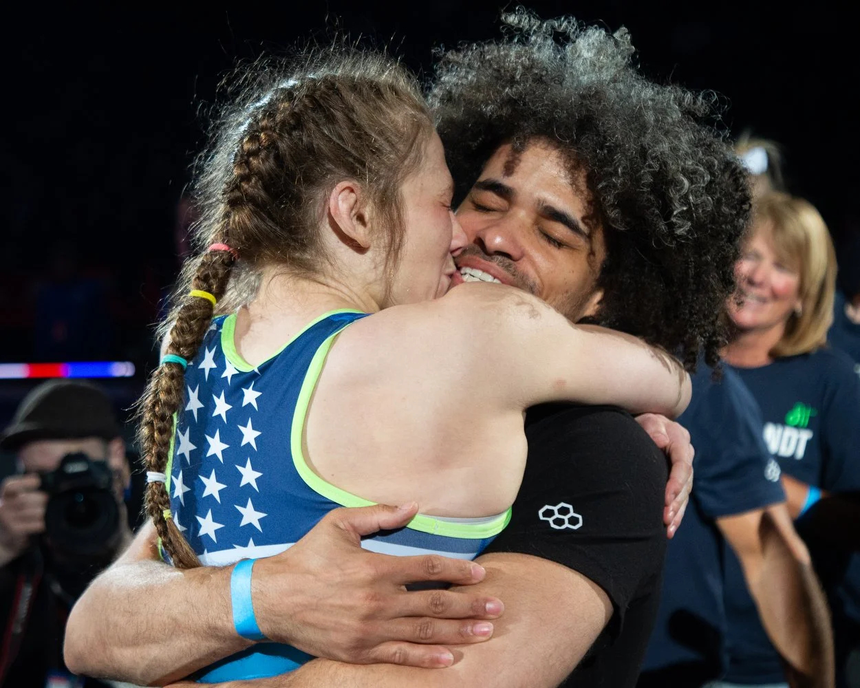 USA wrestler Sarah Hildebrandt (left) kisses boyfriend Donothan Bailey (right) after winning her 50kg championship final match over Audrey Jimenez during day two of 2024 USA Wrestling Team Trials at the Bryce Jordan Center in State College, Pennsylva
