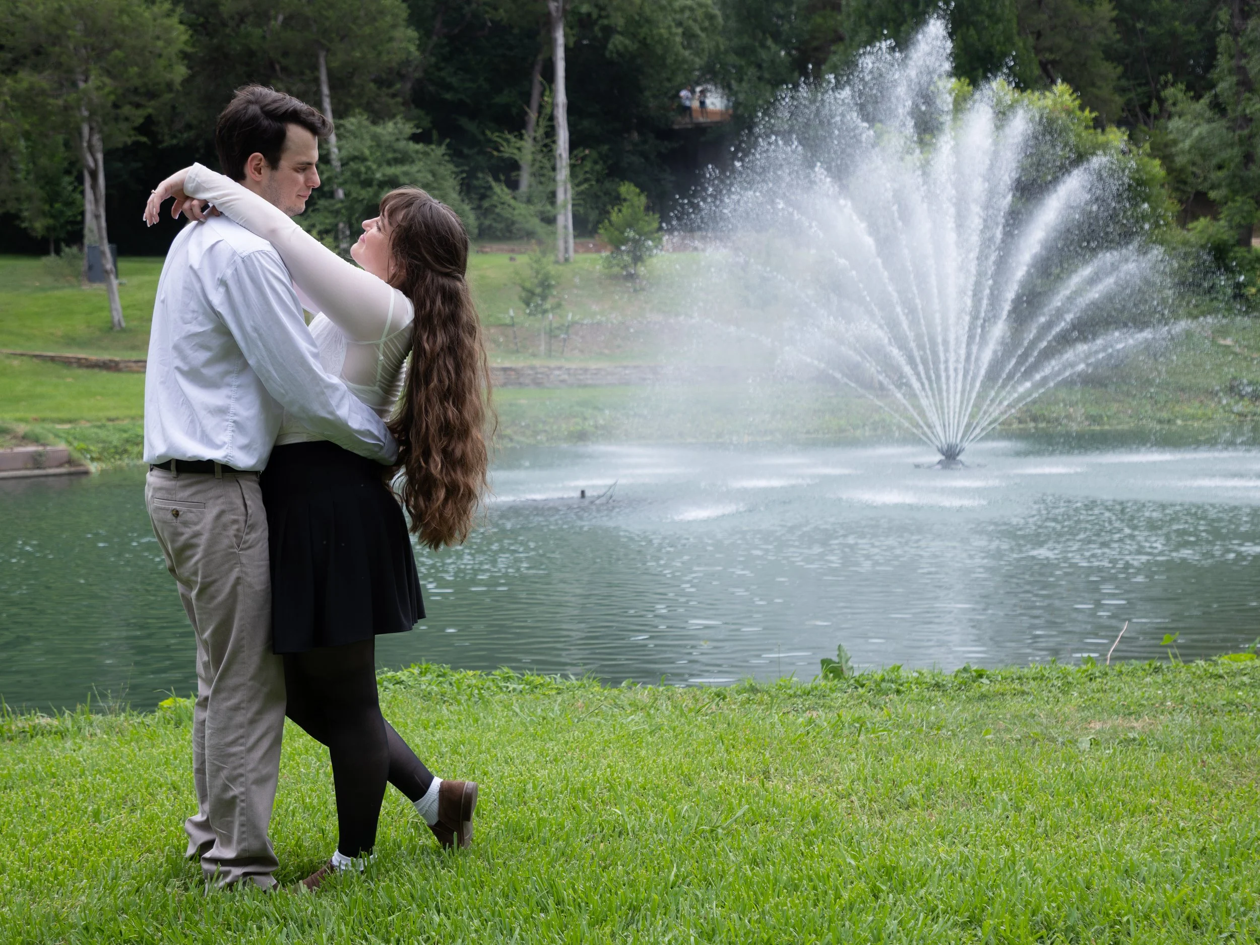 (left to right) Dallas couple Dylan Harvey and Jordan Zaenglein pose for a portrait at Turtle Creek Park in Dallas, Texas on Saturday, June 14, 2026.