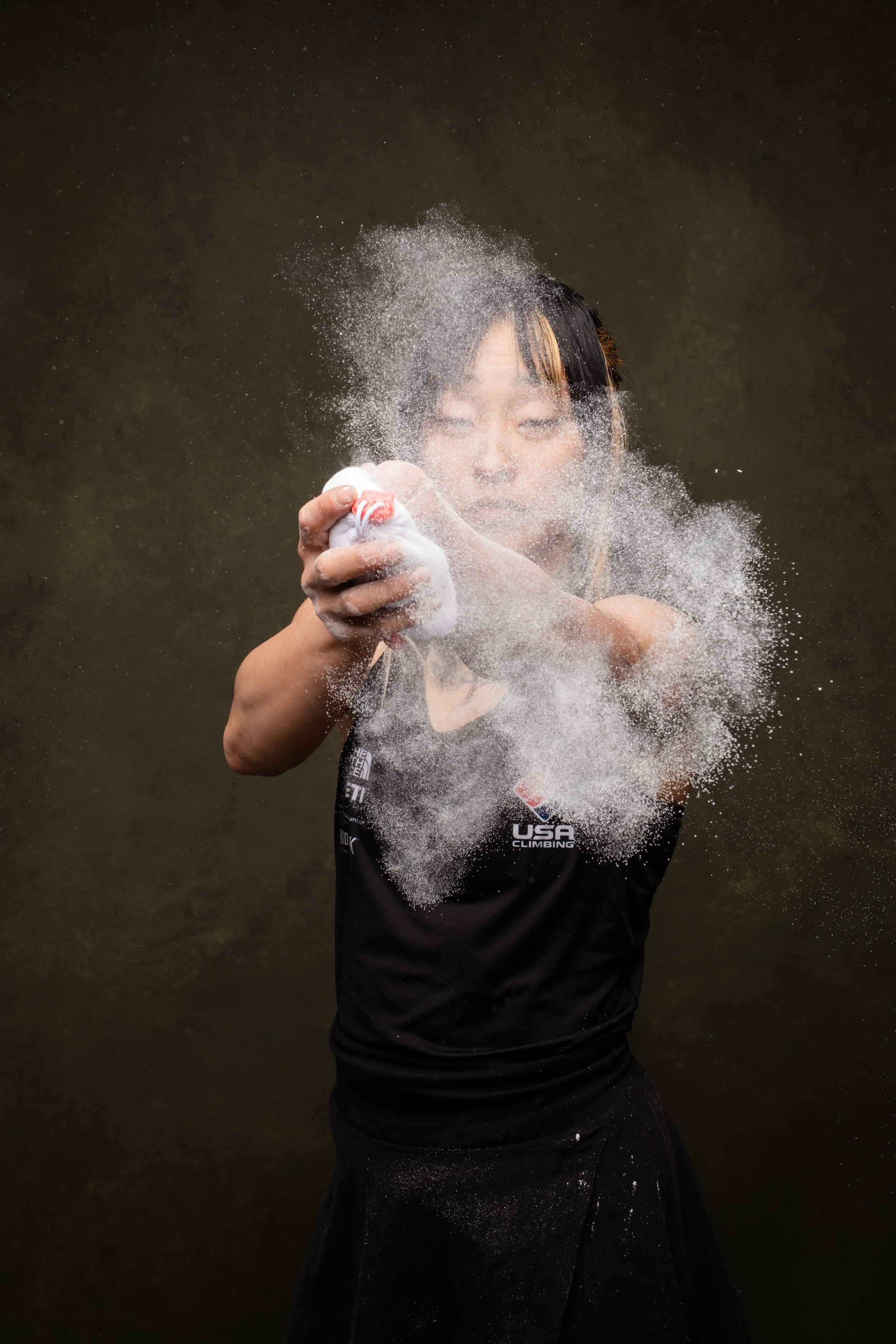 Team USA Climbing Josie puts chalk on her hands