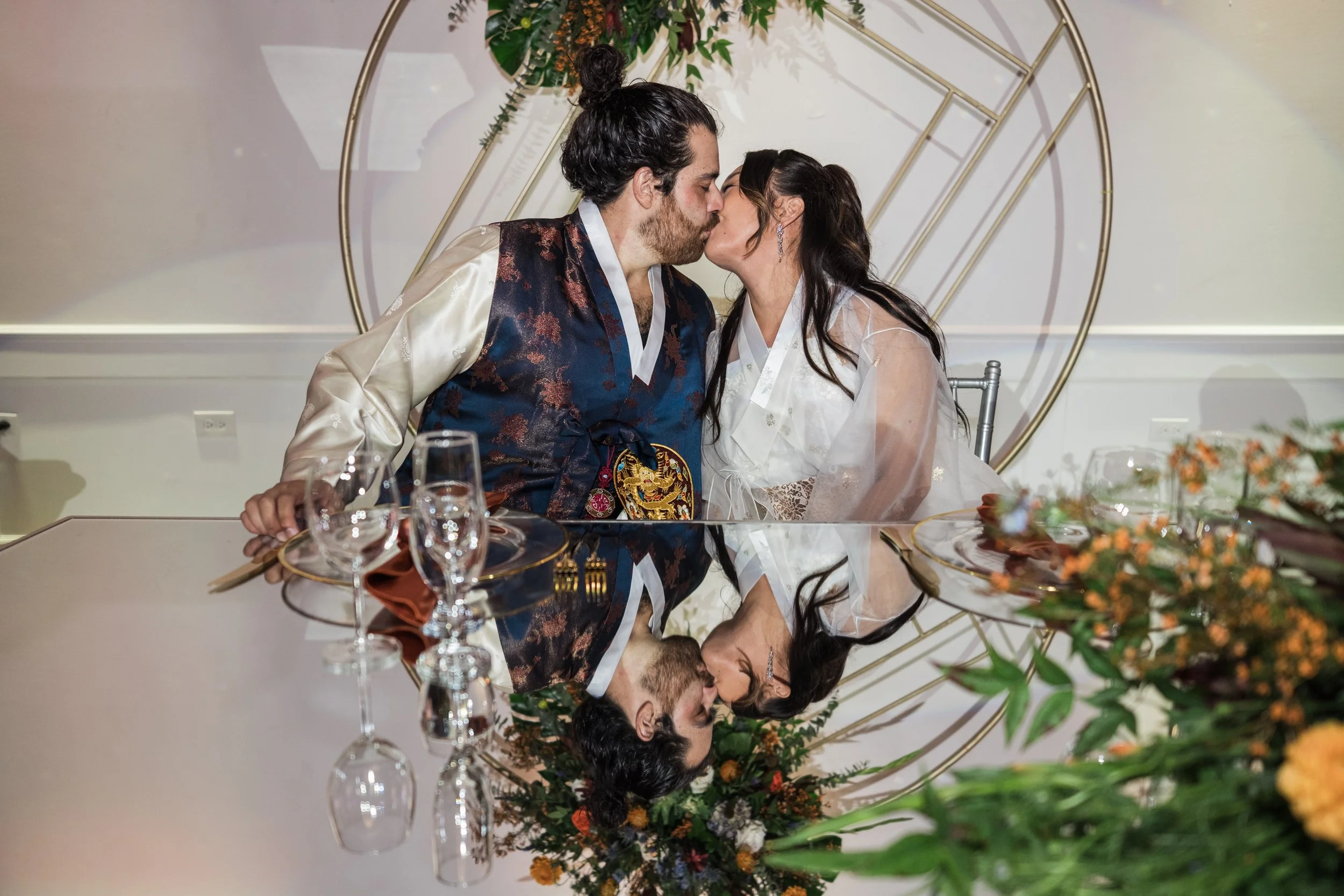 creative reflective portrait of a couple kissing at their wedding - Antoine Didienne documentary wedding photography