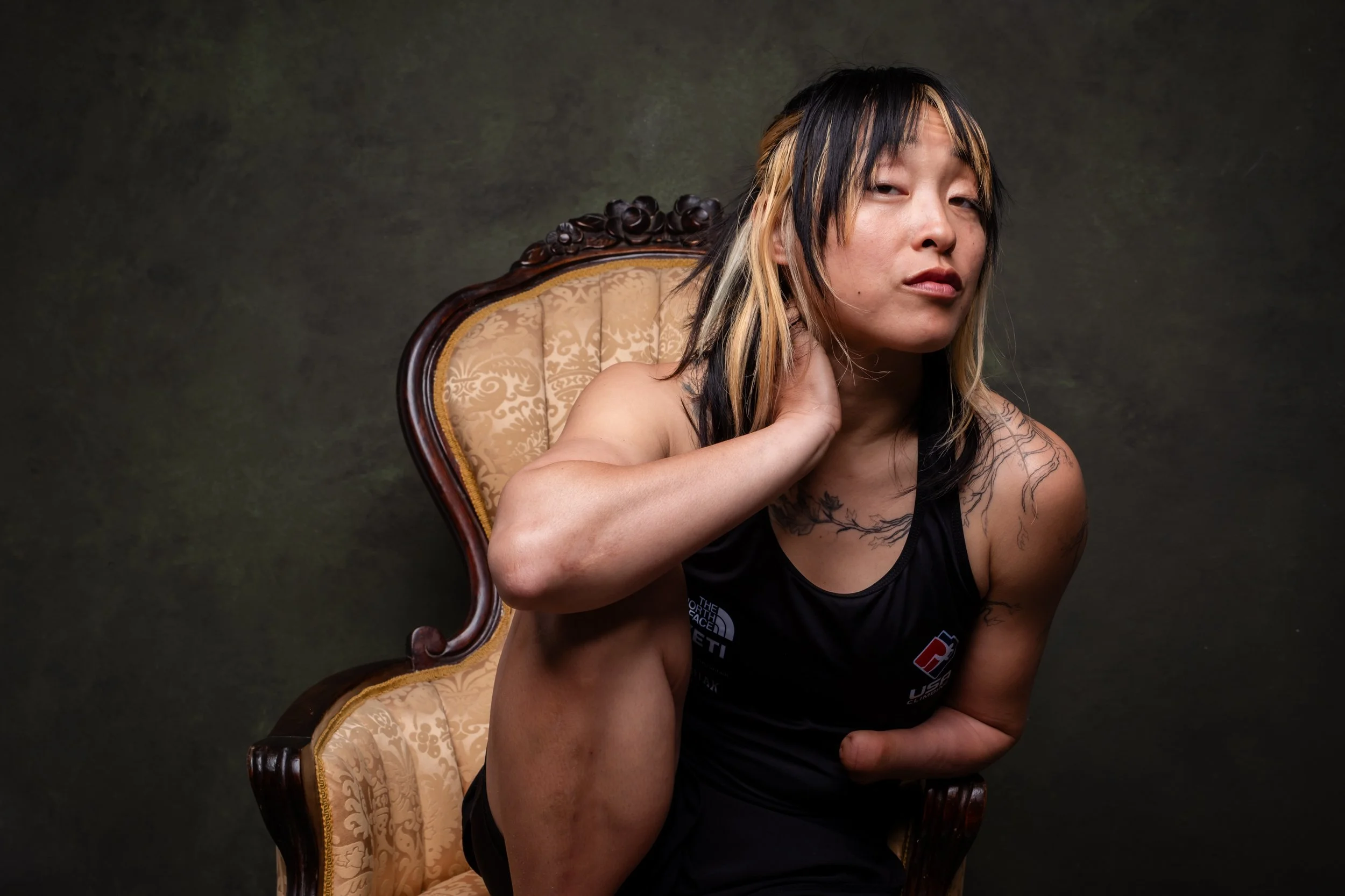 portrait of Josie Fouts on a lavish chair to contrast with her rough and tumble personality