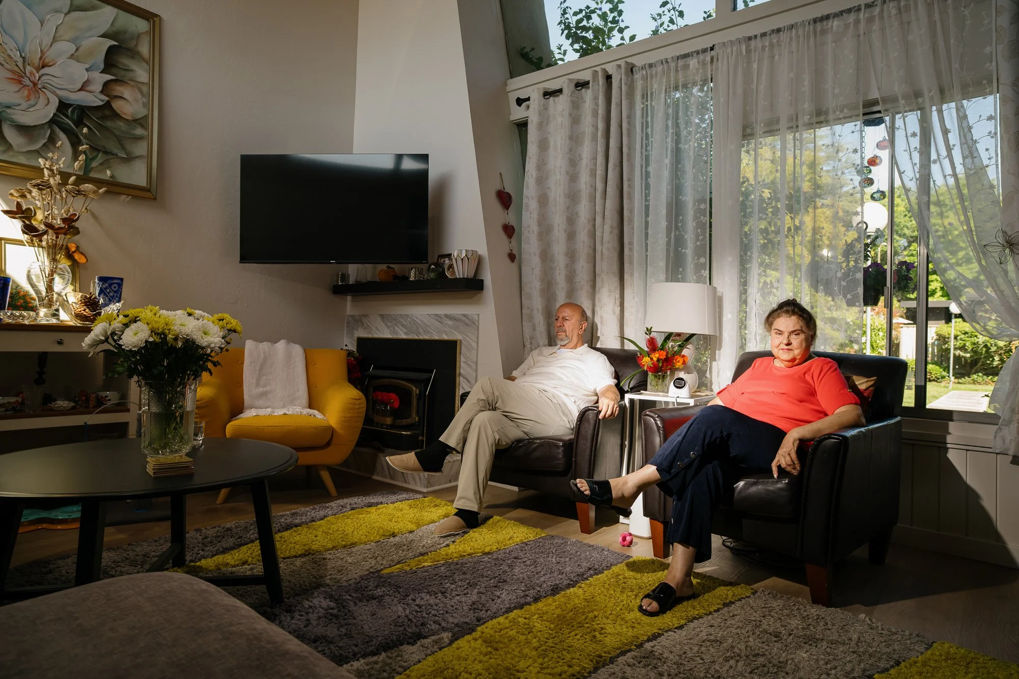 23 - Couple with AI monitor in house for health observations.jpg