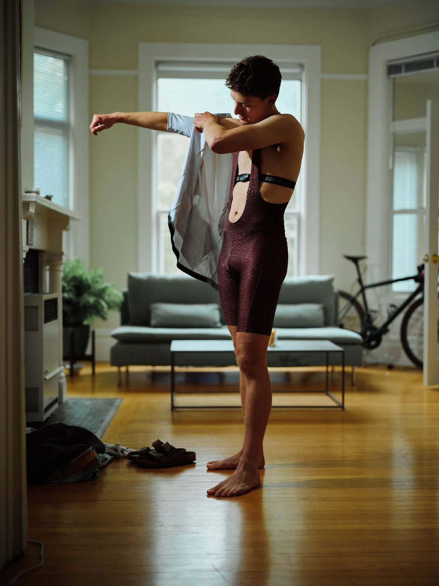 04 - a cyclist kits up at home preparing for a ride.jpg