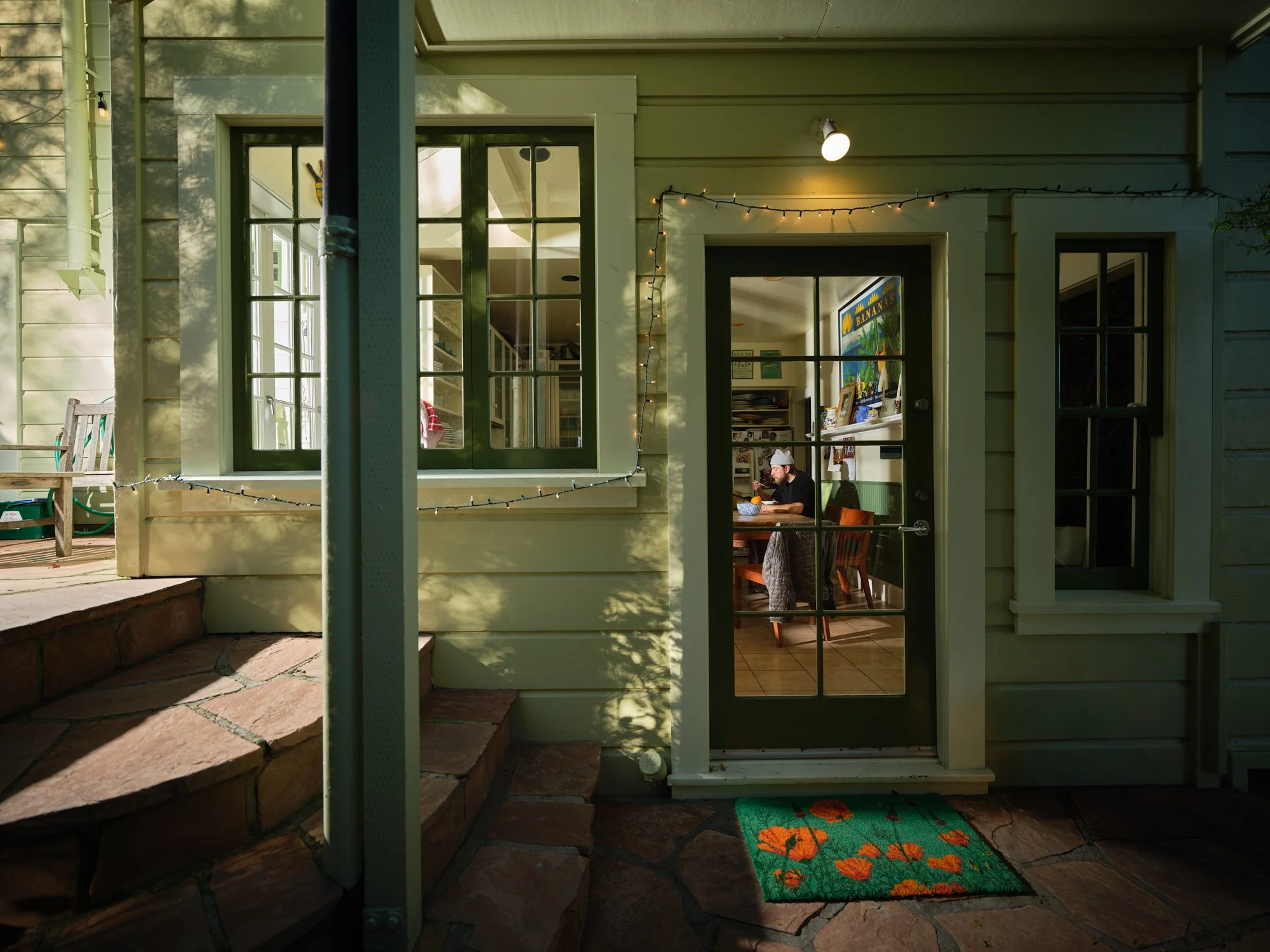 29 - Cyclist sits eating breakfast in his kitchen in San Francisco professional.jpg