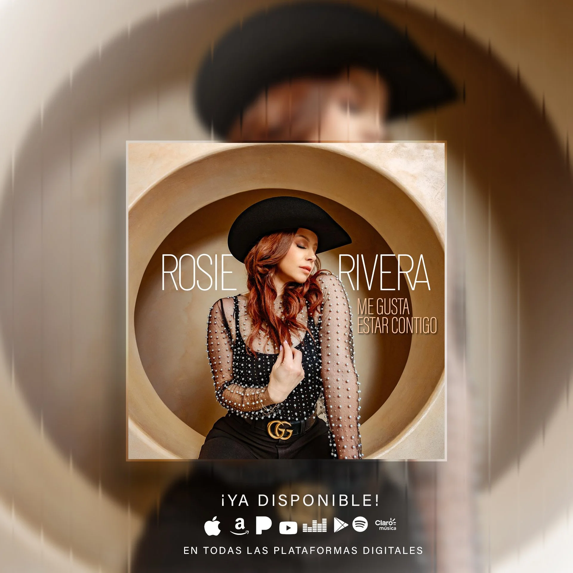 Album cover of Rosie Rivera's music release titled "Me Gusta Estar Contigo" showing Rosie Rivera with long red hair, wearing a black hat and a black sheer top decorated with pearls, standing inside a round beige architectural opening.