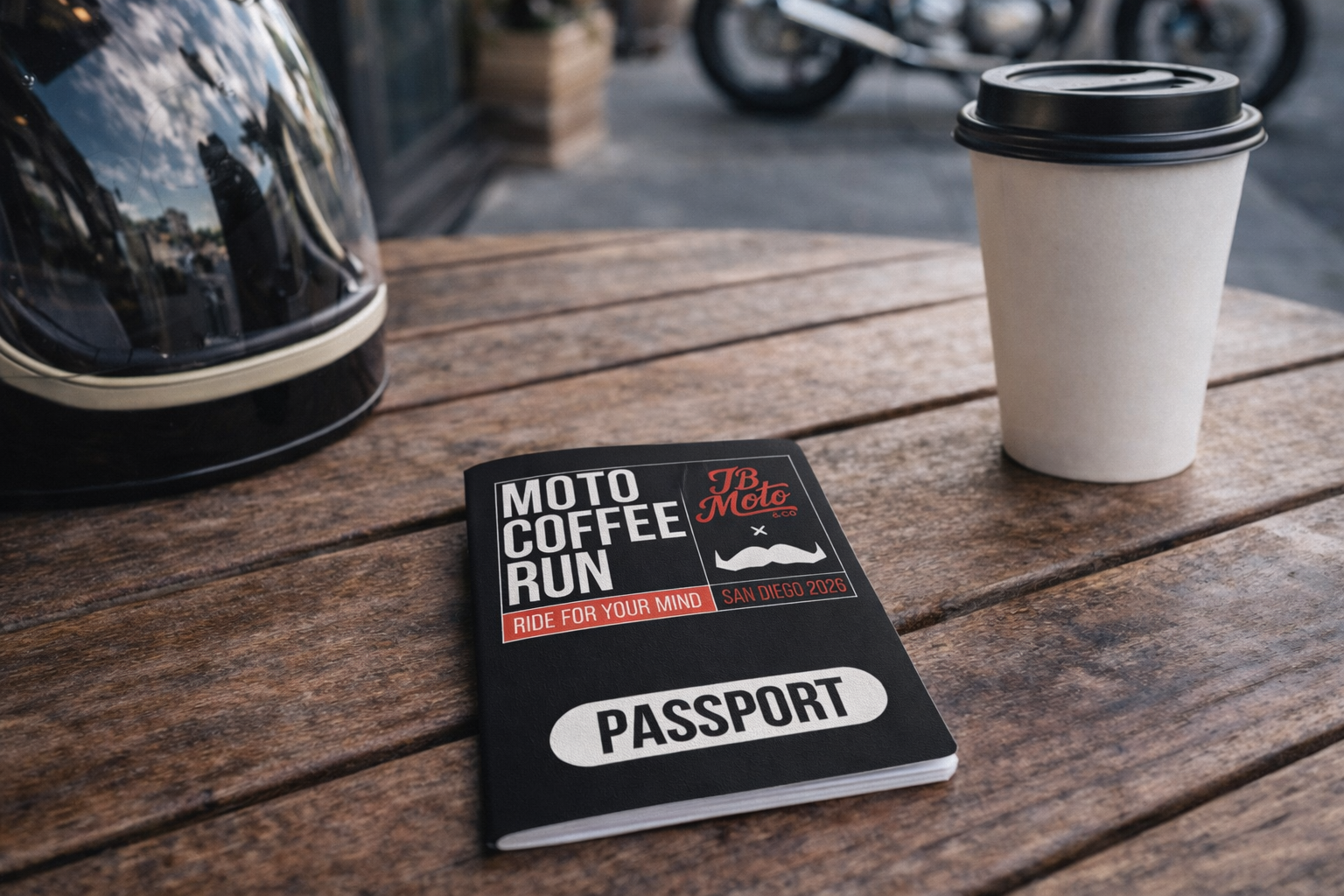 A Moto Coffee Run event passport with a helmet and a paper coffee cup on a wooden table.