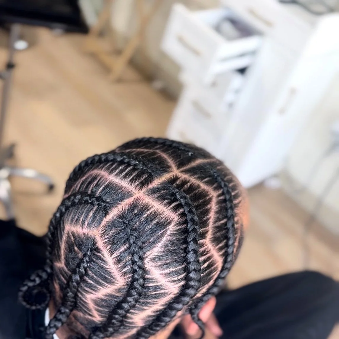 Men’s stitch braids with a custom geometric scalp design