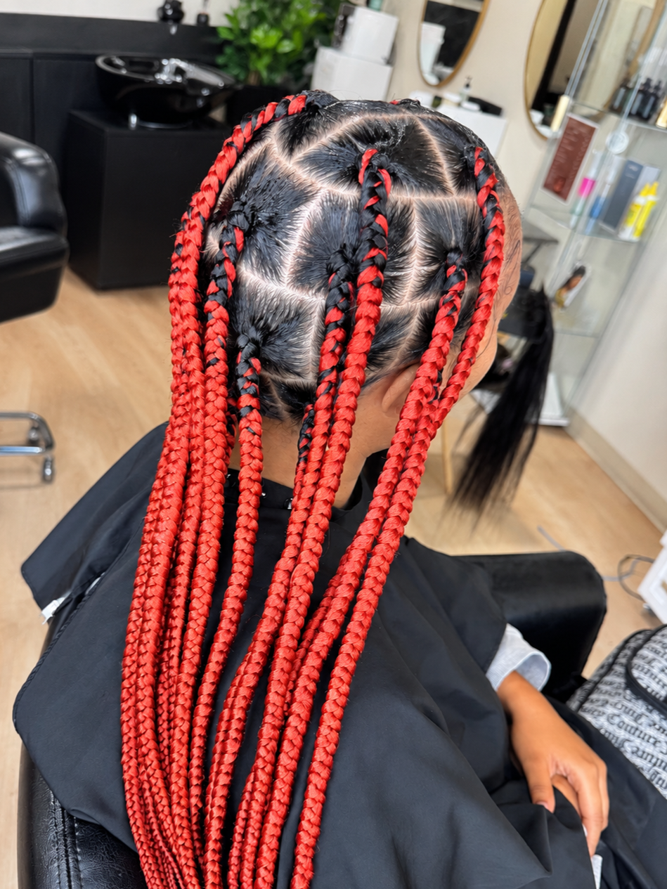Jumbo knotless braids with bold clean parting and red extensions at Legacy Braids in McKinney, TX