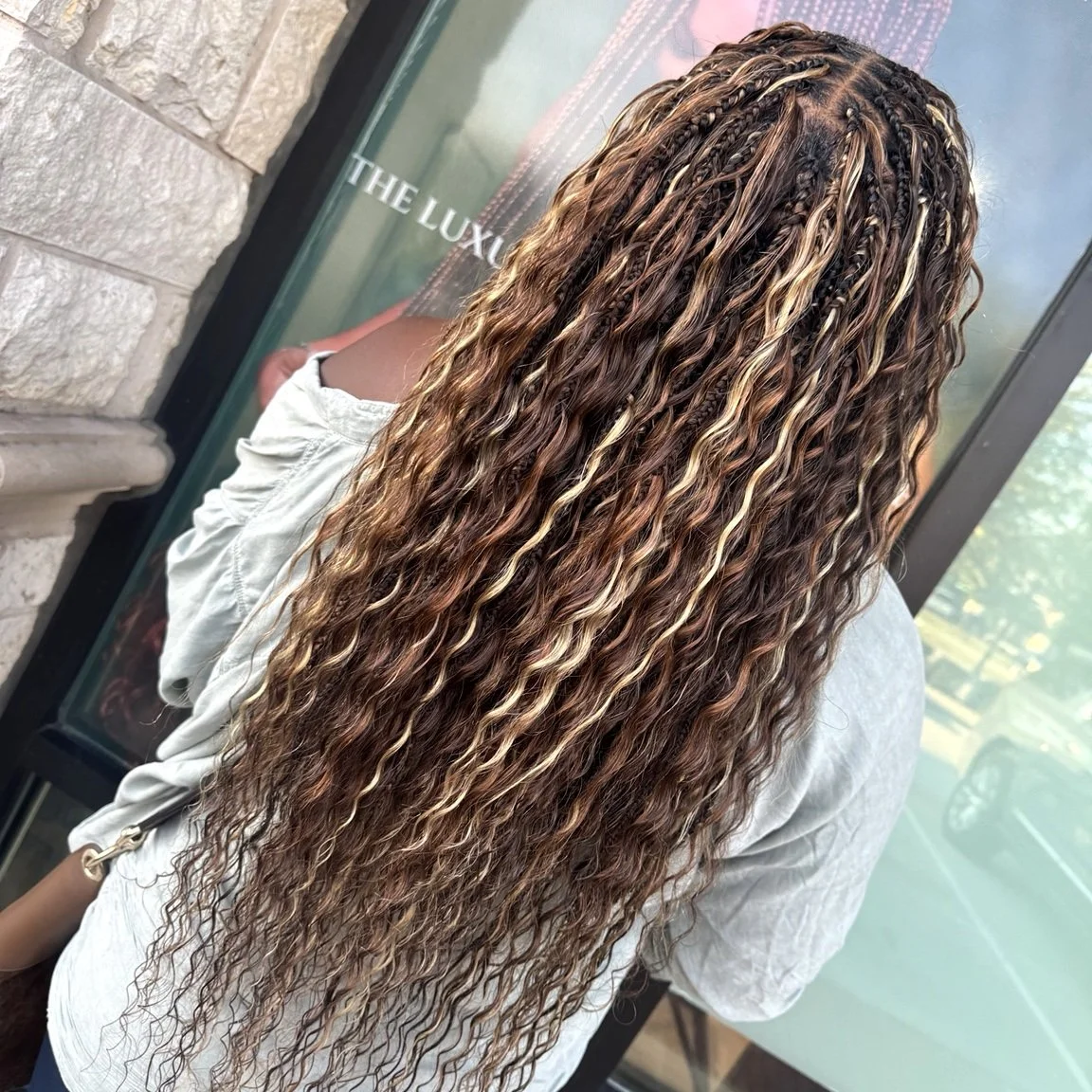 Full-density boho braids with fuller curly human hair at Legacy Braids in McKinney, TX