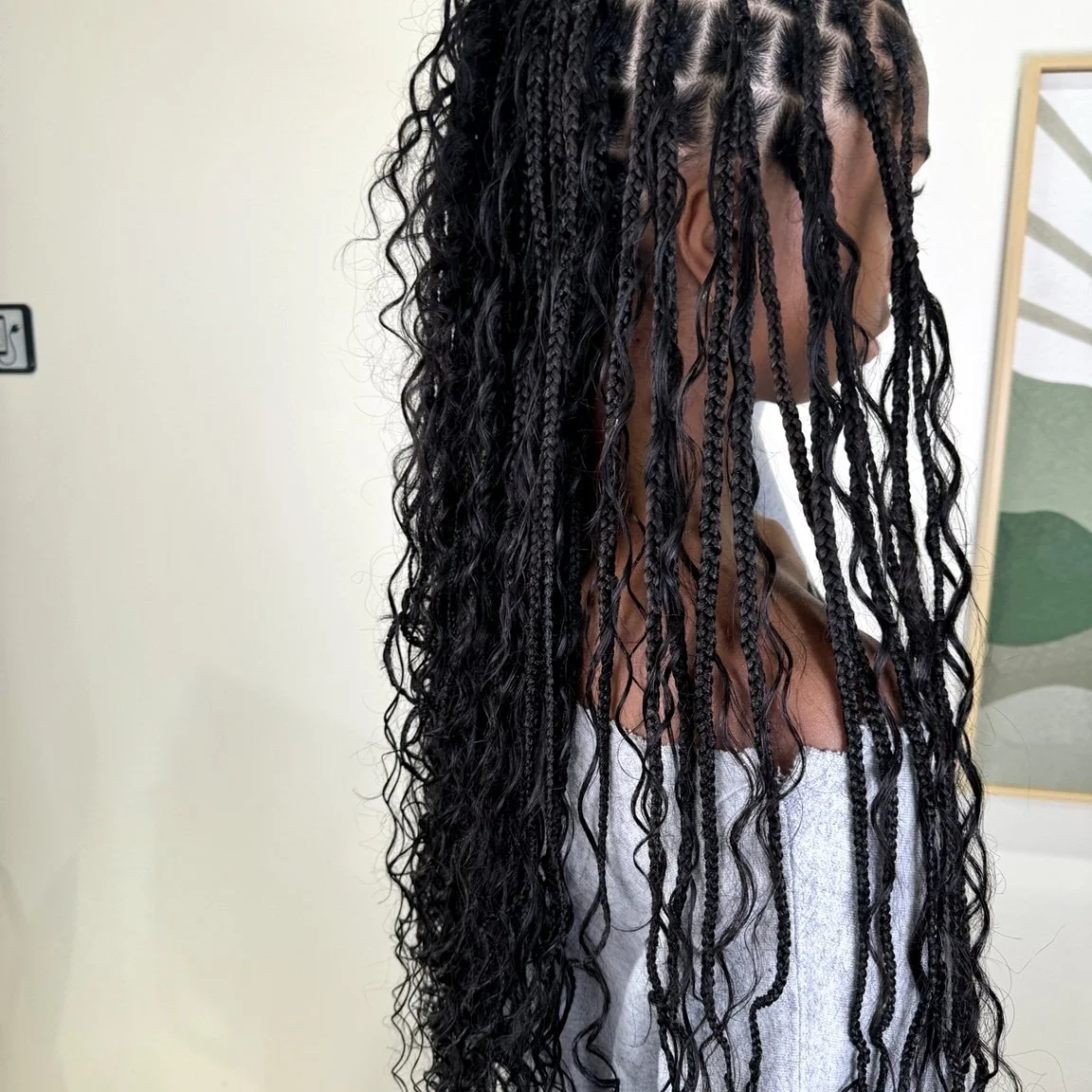 Low-density boho braids with a lightweight, natural-looking curly finish at Legacy Braids in McKinney, TX