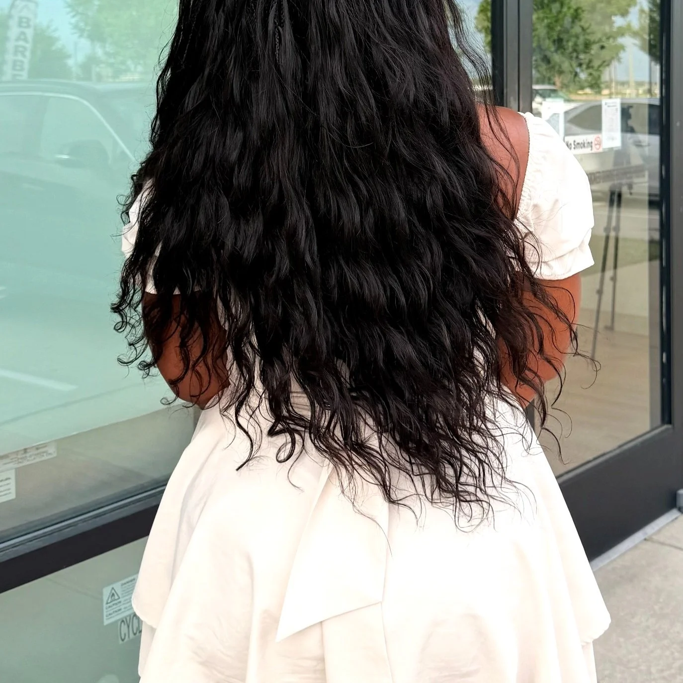 Black Miracle Knots with long wavy curly human hair at Legacy Braids in McKinney, TX
