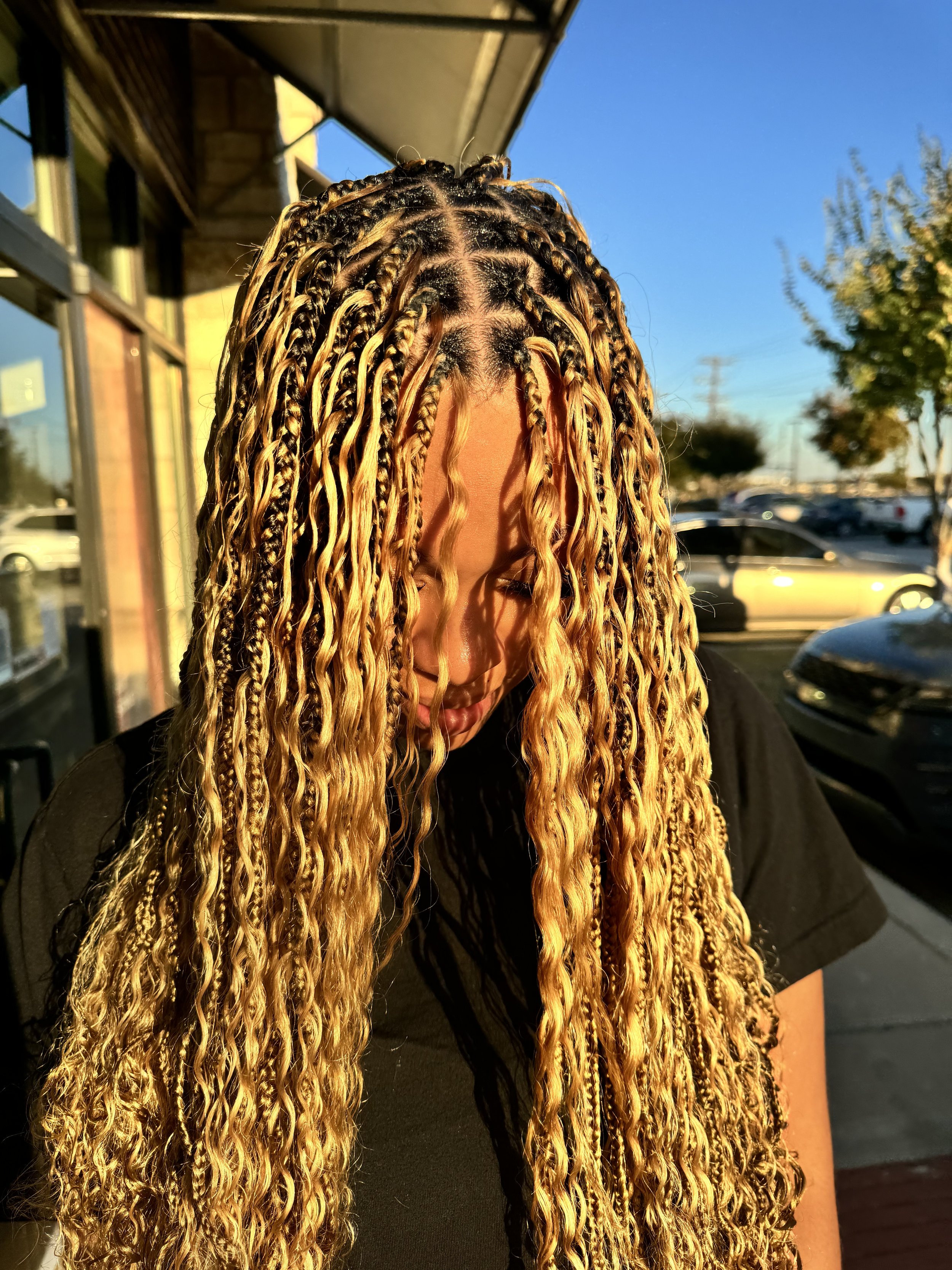 Boho braids with long blonde curly human hair at Legacy Braids in McKinney, TX