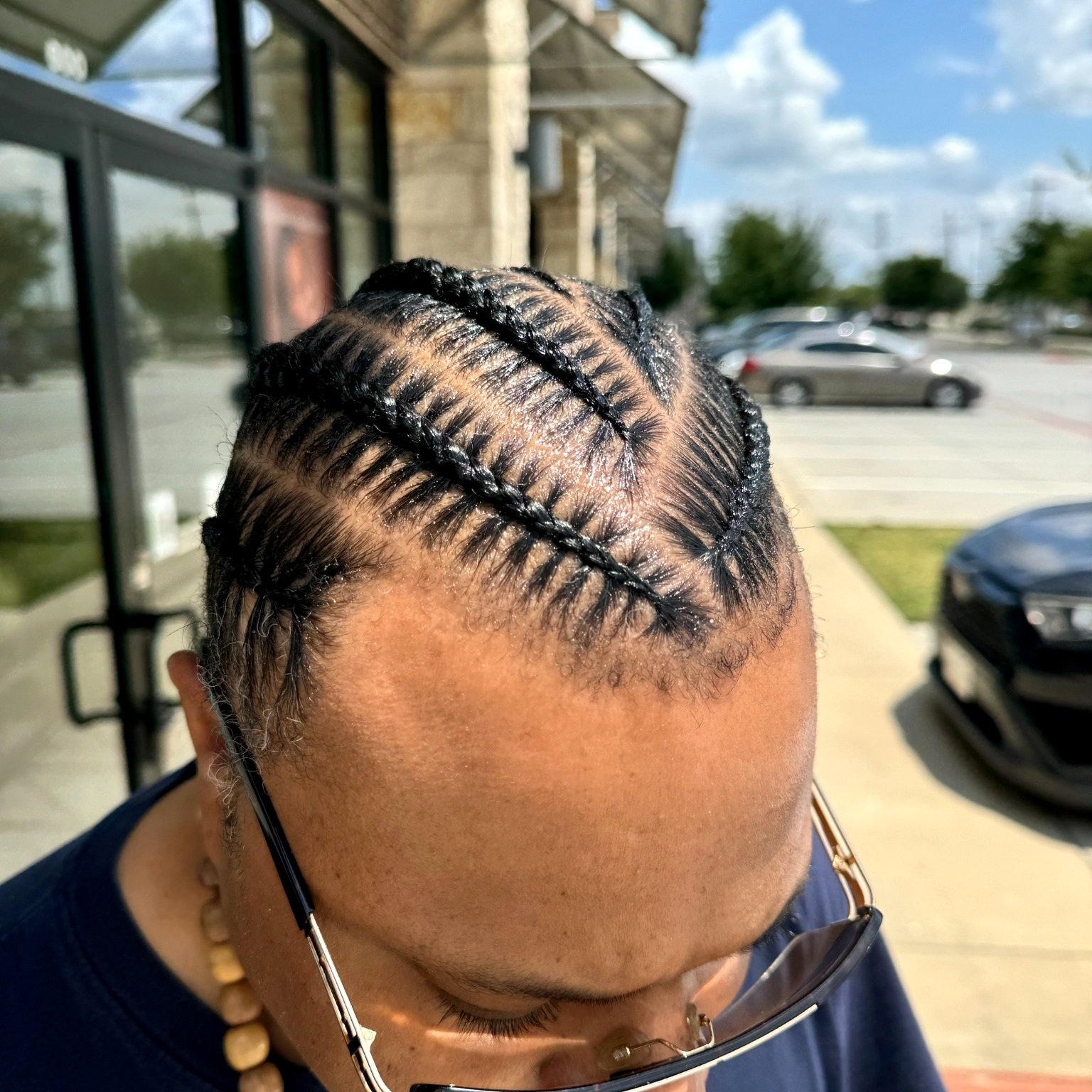 6 Men’s stitch braids with a curved stitch pattern and clean hairline
