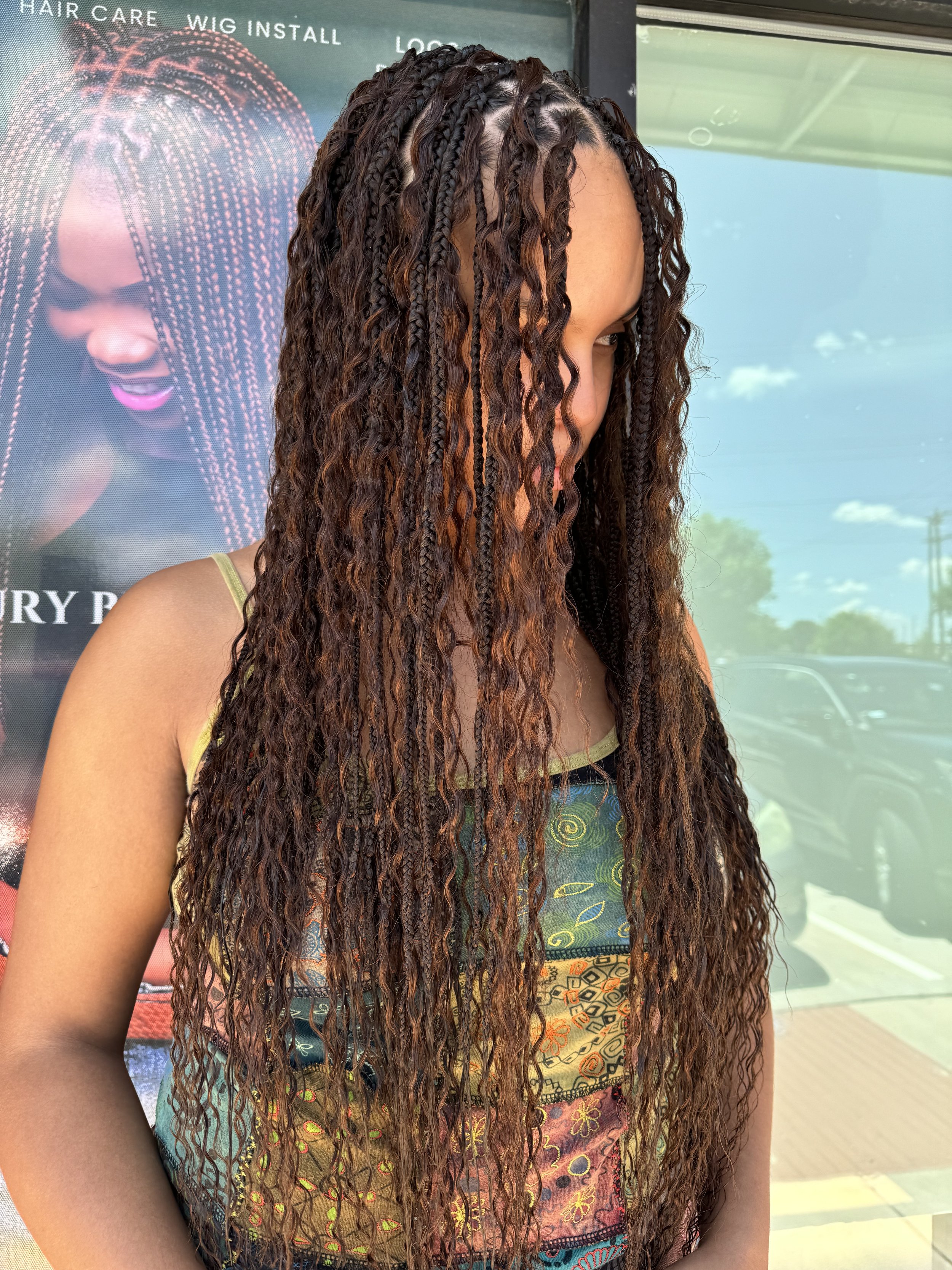 Long brown boho braids with curly human hair at Legacy Braids in McKinney, TX