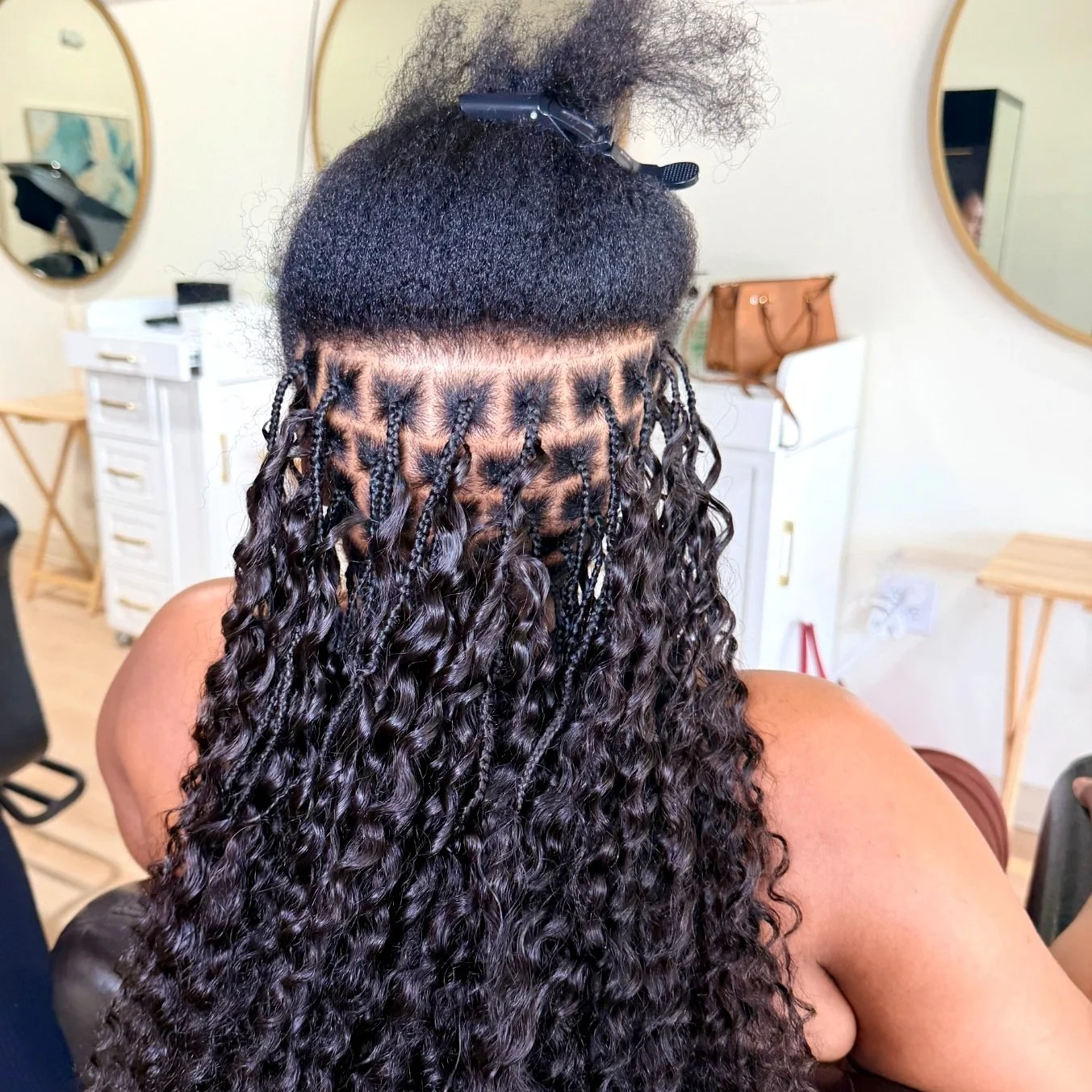 Miracle Knots showing the braided natural-hair foundation with black curly human hair at Legacy Braids in McKinney, TX